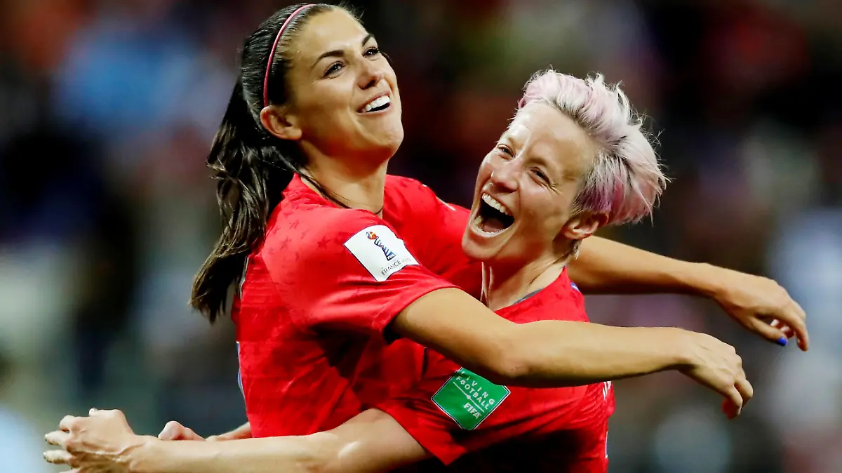 Soccer Football - Women's World Cup - Group F - United States v Thailand - Stade Auguste-Delaune, Reims, France - June 11, 2019 Alex Morgan of the U.S. celebrates scoring their twelfth goal with Megan Rapinoe REUTERS/Christian Hartmann TPX IMAGES OF THE DAY