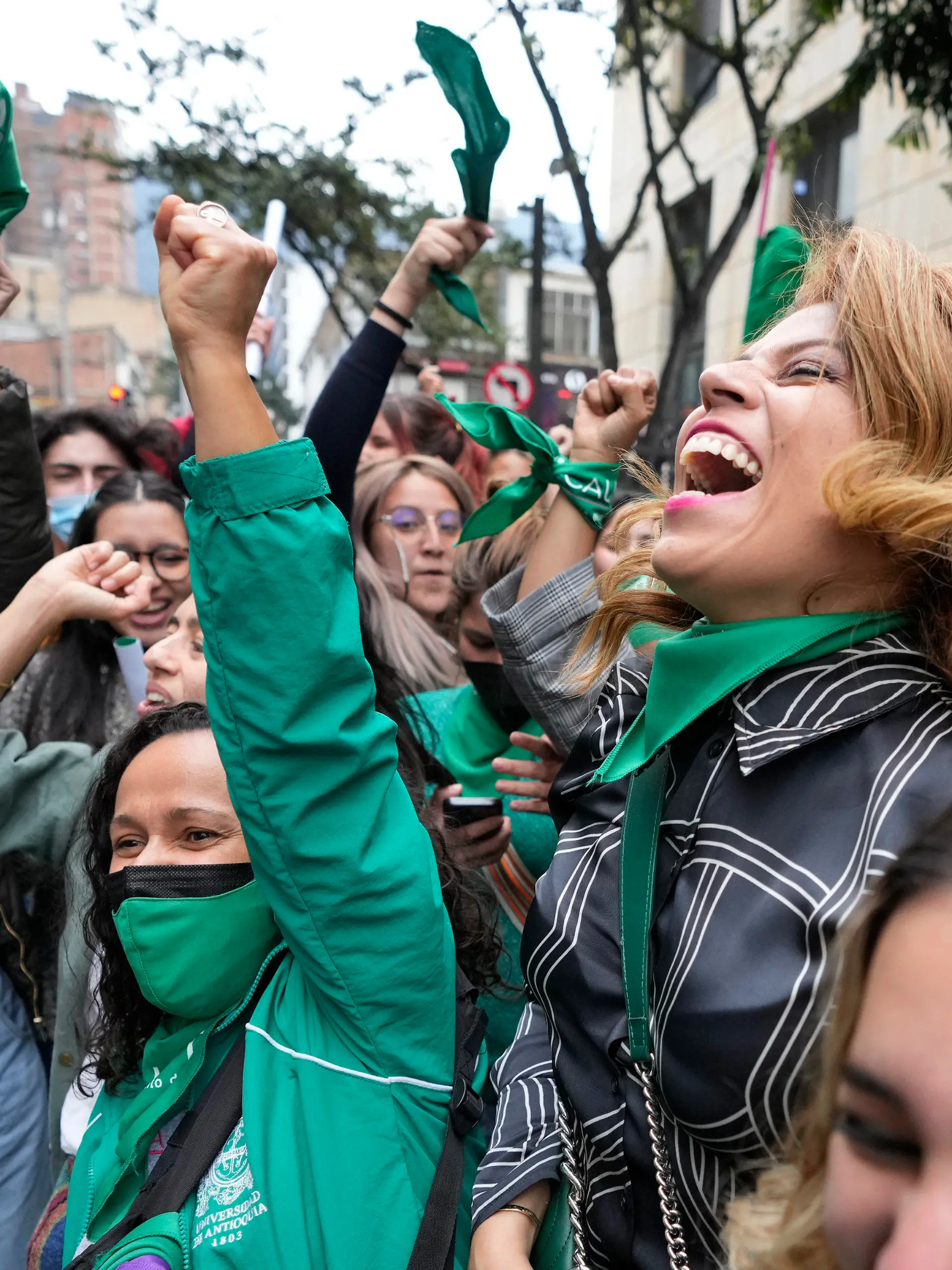 Abortion-rights activists celebrate after the Constitutional Court approved the decriminalization of abortion, lifting all limitations on the procedure until the 24th week of pregnancy, in Bogota, Colombia, Monday, Feb. 21, 2022. (AP Photo/Fernando Vergara)
