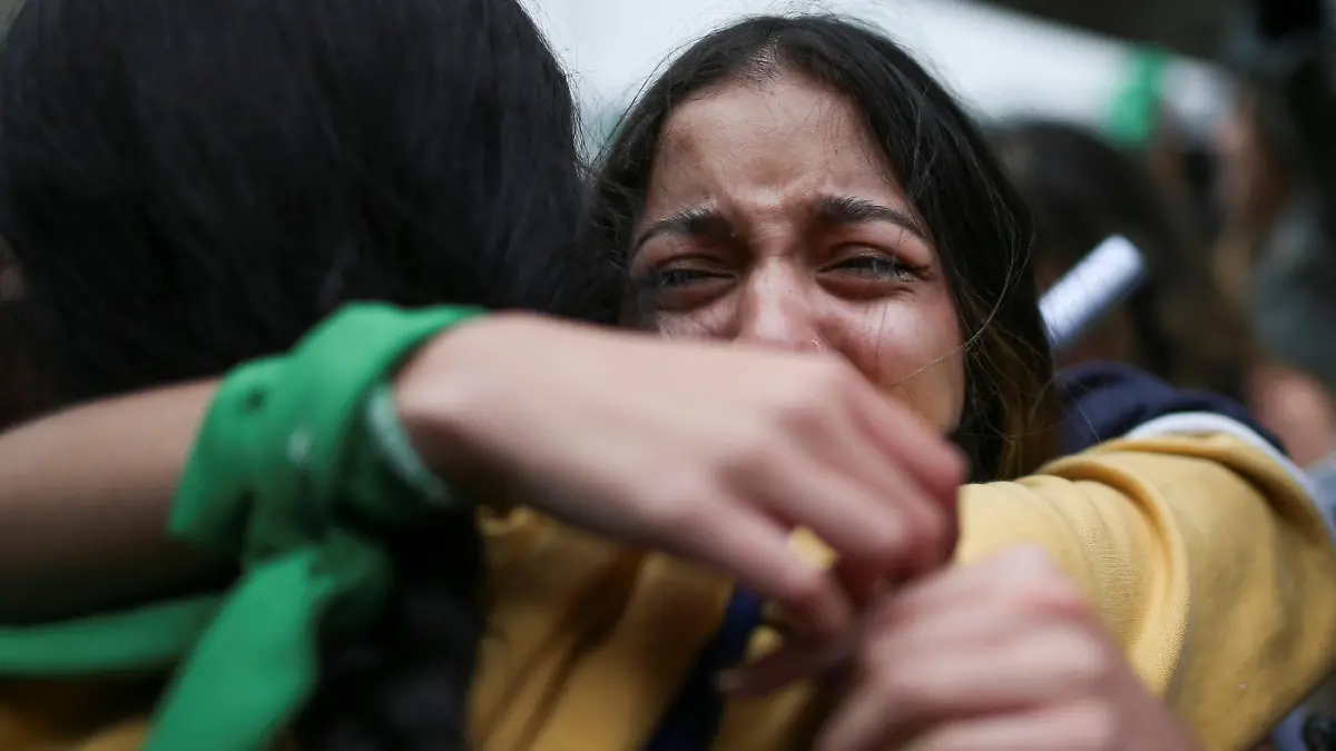 Women react after Colombia's constitutional court voted to decriminalize abortion until 24 weeks of gestation, in Bogota, Colombia February 21, 2022. REUTERS/Luisa Gonzalez.