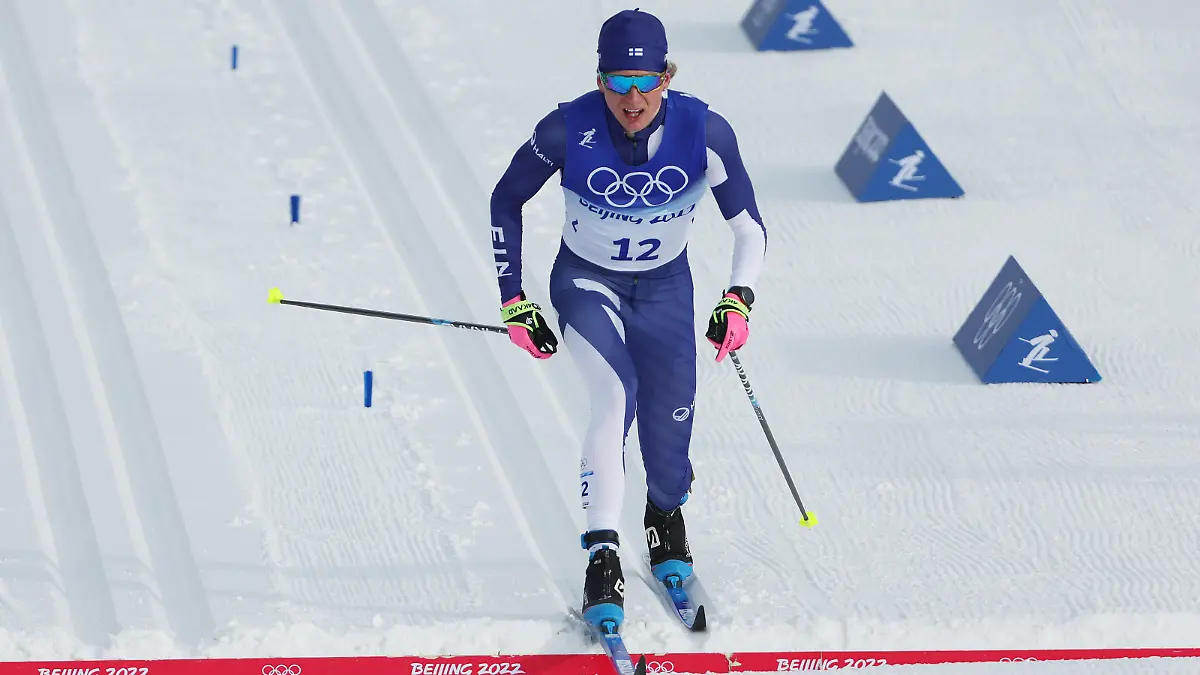 ZHANGJIAKOU, CHINA - FEBRUARY 11: Remi Lindholm of Team Finland crosses the finish line during the Men's Cross-Country Skiing 15km Classic on Day 7 of  Beijing 2022 Winter Olympics at The National Cross-Country Skiing Centre on February 11, 2022 in Zhangjiakou, China. (Photo by Patrick Smith/Getty Images)