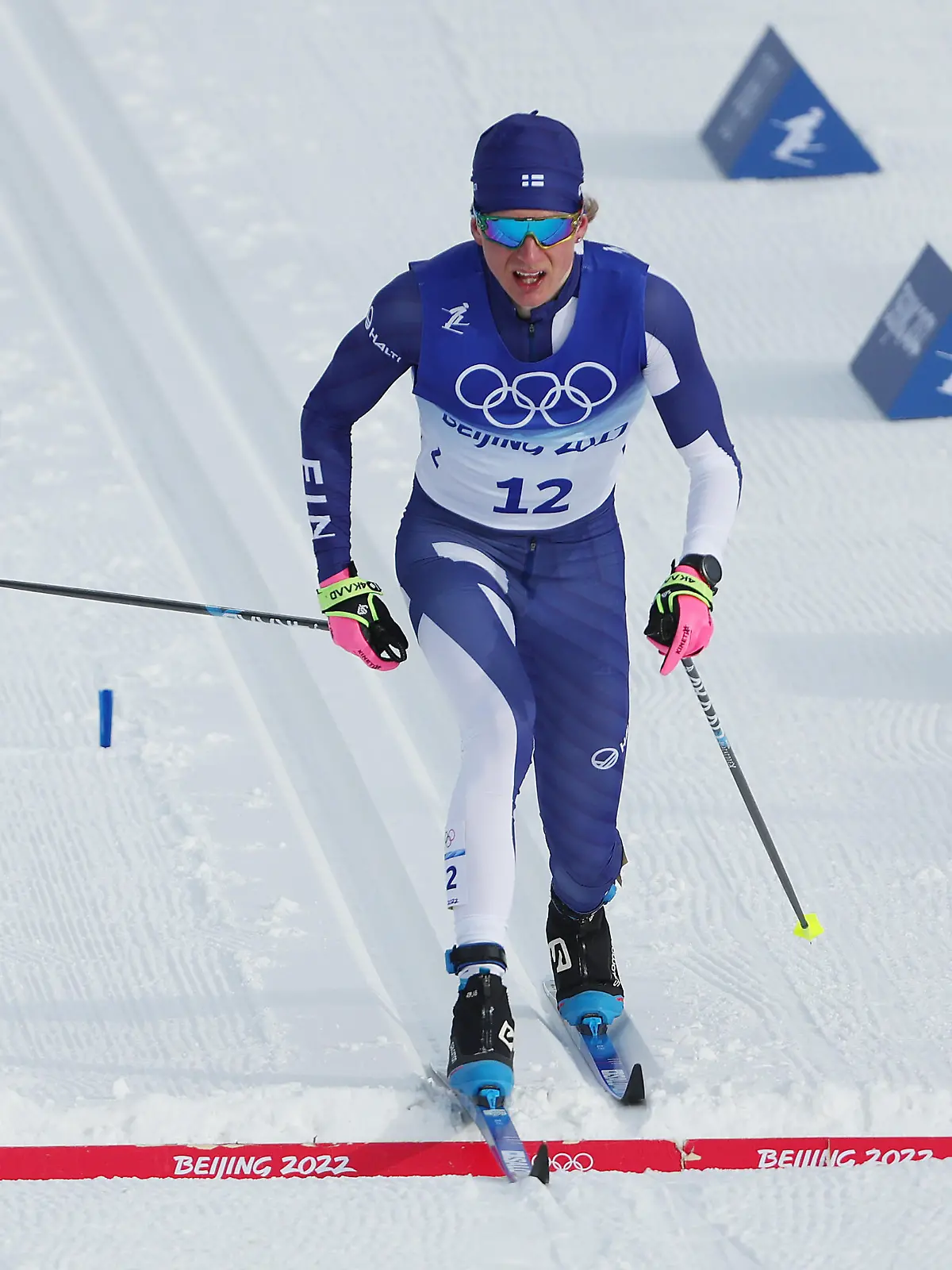 ZHANGJIAKOU, CHINA - FEBRUARY 11: Remi Lindholm of Team Finland crosses the finish line during the Men's Cross-Country Skiing 15km Classic on Day 7 of  Beijing 2022 Winter Olympics at The National Cross-Country Skiing Centre on February 11, 2022 in Zhangjiakou, China. (Photo by Patrick Smith/Getty Images)