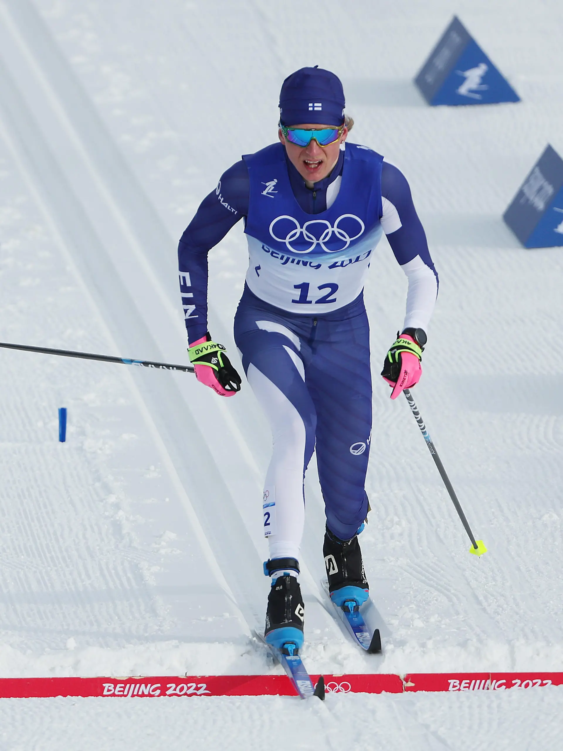 ZHANGJIAKOU, CHINA - FEBRUARY 11: Remi Lindholm of Team Finland crosses the finish line during the Men's Cross-Country Skiing 15km Classic on Day 7 of  Beijing 2022 Winter Olympics at The National Cross-Country Skiing Centre on February 11, 2022 in Zhangjiakou, China. (Photo by Patrick Smith/Getty Images)