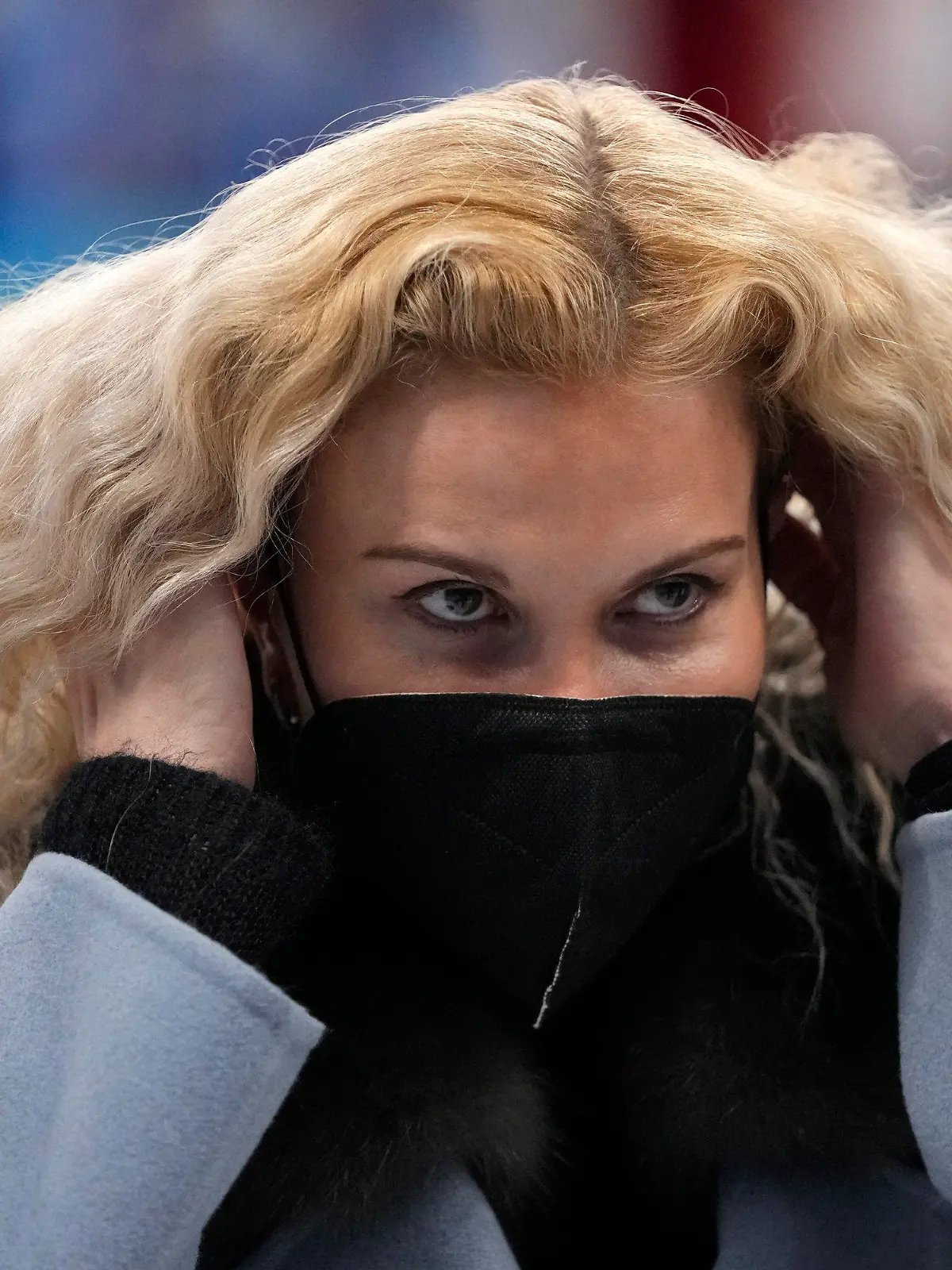 Eteri Tutberidze reacts following the pairs free skate program during the figure skating competition at the 2022 Winter Olympics, Saturday, Feb. 19, 2022, in Beijing. (AP Photo/Natacha Pisarenko)