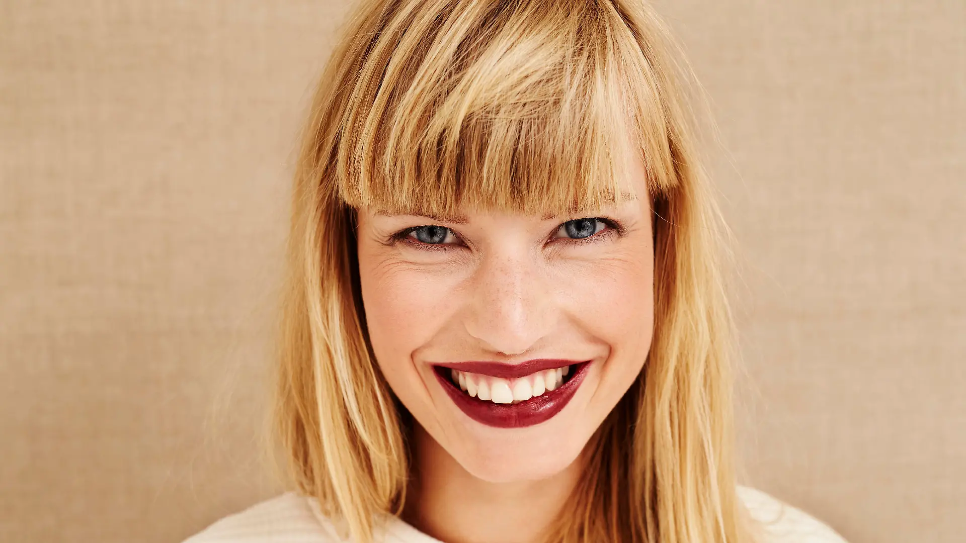 Portrait of beautiful smiling woman in studio