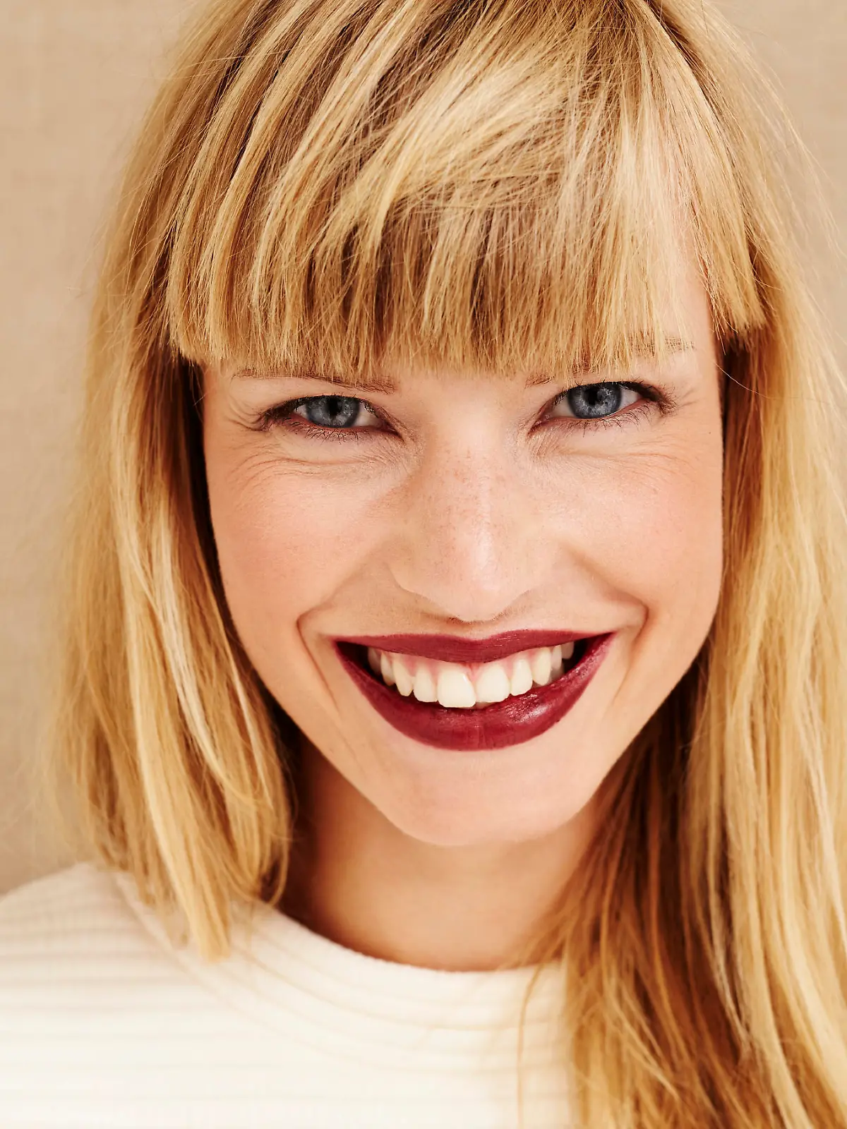 Portrait of beautiful smiling woman in studio