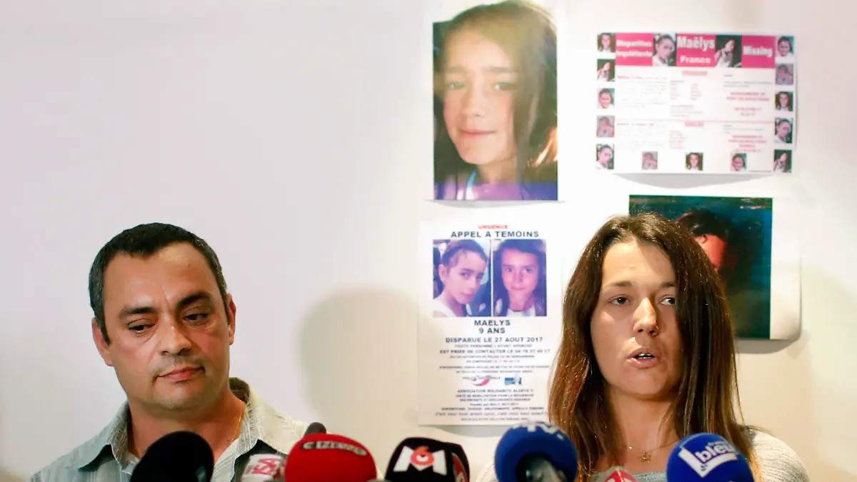 FILE - The father of killed girl, Maelys, Joachim de Araujo, left, and his wife, Jennifer, hold a press conference in Lyon, central France, Sept.28 2017. Nordahl Lelandais, goes on trial Monday Jan.31, 2022 in Grenoble accused of kidnapping and killing Maëlys, as well as for sexual violence against two of his cousins, age 5 and 6, and possession of pedophile images. He faces up to life in prison if convicted. (AP Photo/Laurent Cipriani, File)