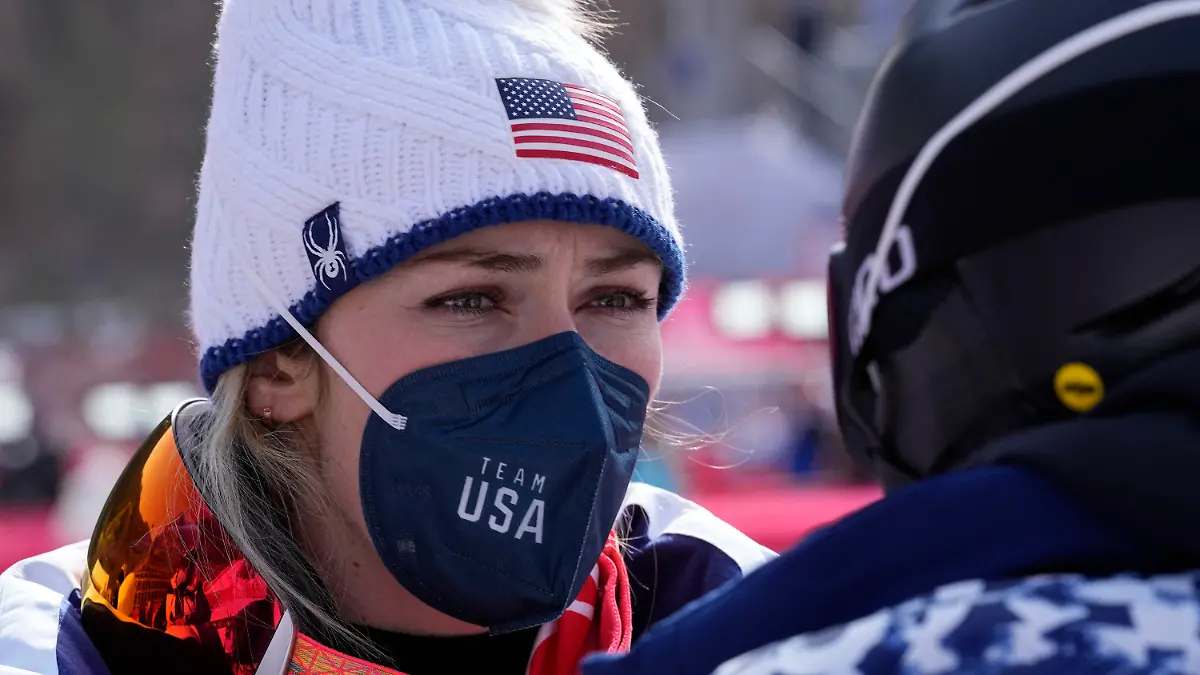 Mikaela Shiffrin of United States stands in the finish area after completing the women's super-G at the 2022 Winter Olympics, Friday, Feb. 11, 2022, in the Yanqing district of Beijing. (AP Photo/Robert F. Bukaty)
