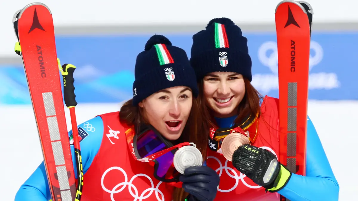2022 Beijing Olympics - Victory Ceremony - Alpine Skiing - Women's Downhill - National Alpine Skiing Centre, Yanqing district, Beijing, China - February 15, 2022.  Silver medallist Sofia Goggia of Italy and her compatriot bronze medallist Nadia Delago of Italy pose with their medals during the victory ceremony. REUTERS/Denis Balibouse