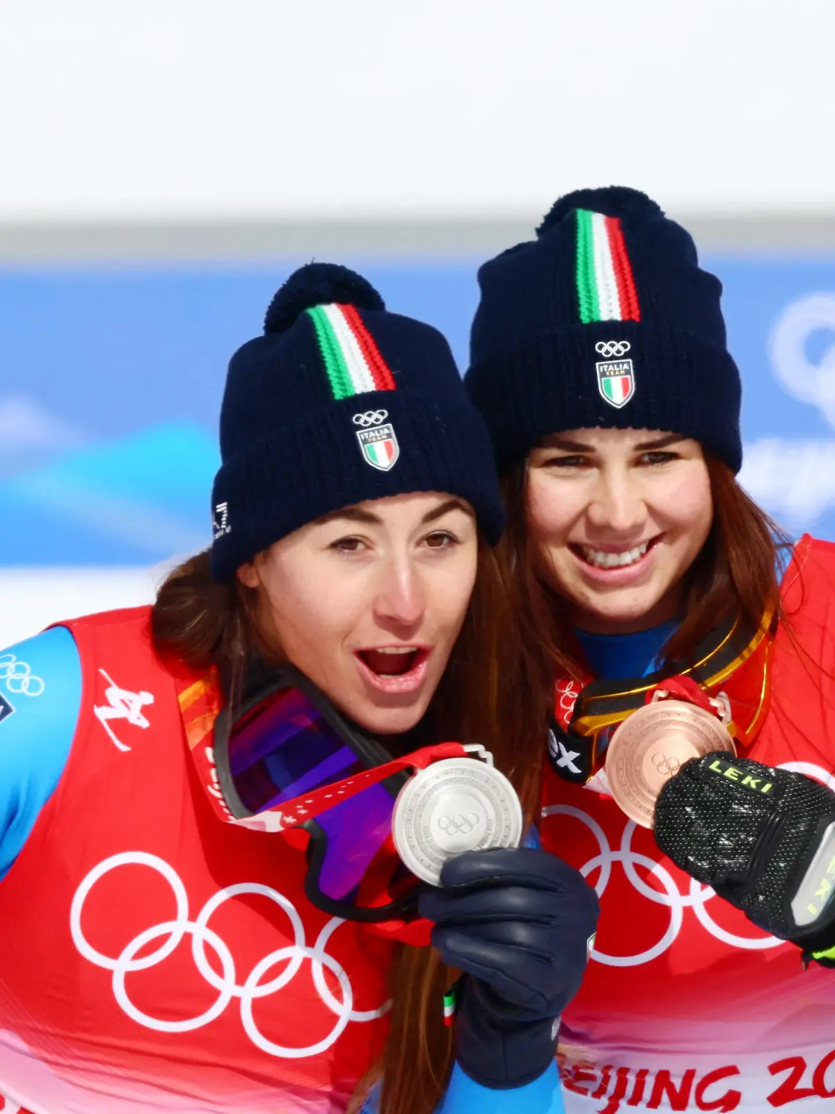 2022 Beijing Olympics - Victory Ceremony - Alpine Skiing - Women's Downhill - National Alpine Skiing Centre, Yanqing district, Beijing, China - February 15, 2022.  Silver medallist Sofia Goggia of Italy and her compatriot bronze medallist Nadia Delago of Italy pose with their medals during the victory ceremony. REUTERS/Denis Balibouse