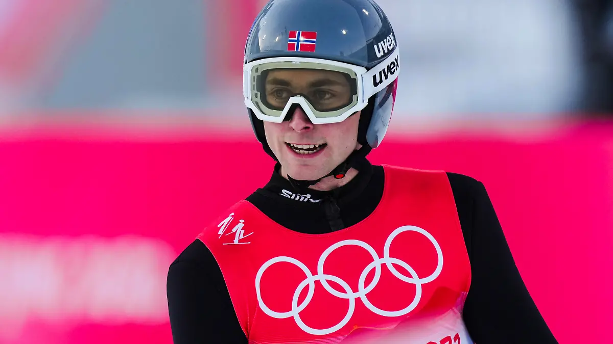 Jarl Magnus Riiber, of Norway, reacts after his jump during the competition round of the individual Gundersen large hill/10km, ski jumping competition at the 2022 Winter Olympics, Tuesday, Feb. 15, 2022, in Zhangjiakou, China. (AP Photo/Matthias Schrader)