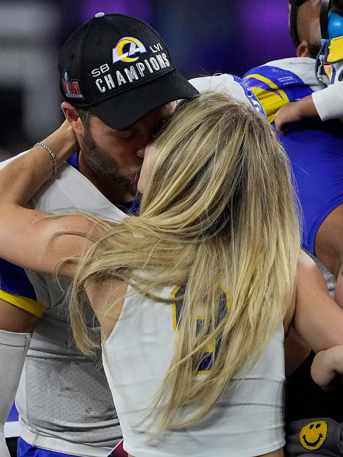 Los Angeles Rams quarterback Matthew Stafford kisses his wife Kelly Hall after the NFL Super Bowl 56 football game against the Cincinnati Bengals, Sunday, Feb. 13, 2022, in Inglewood, Calif. The Los Angeles Rams won 23-20. (AP Photo/Tony Gutierrez)