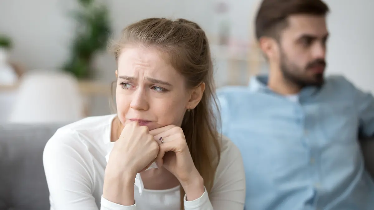 Close up of sad woman cry after fight with husband, unhappy young wife feel lonely having disagreement with spouse, upset female look in distance thinking of relationships problems or breakup
