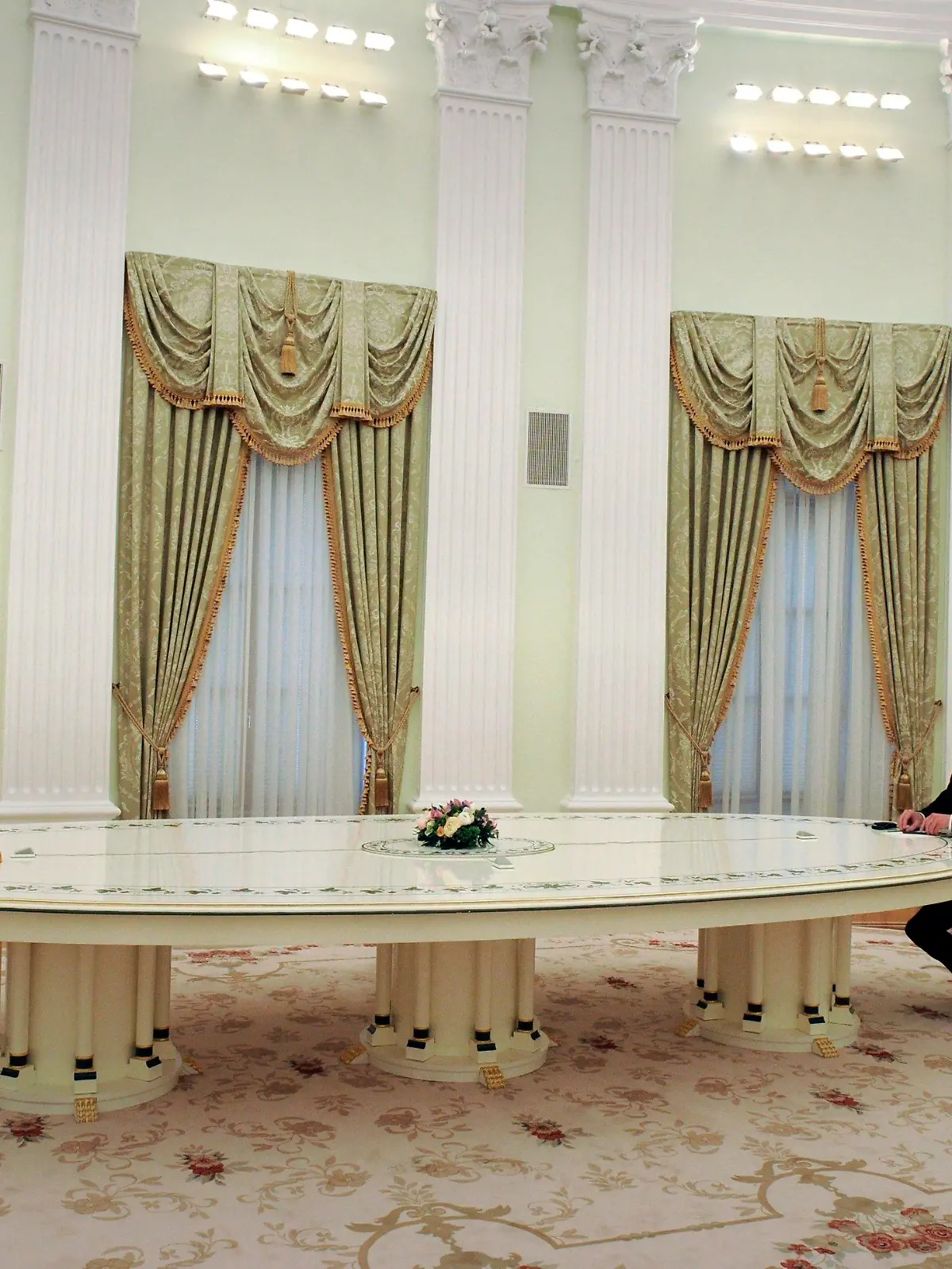 Russian President Vladimir Putin, left, and German Chancellor Olaf Scholz during their talks in the Kremlin in Moscow, Russia, Tuesday, Feb. 15, 2022. (Mikhail Klimentyev, Sputnik, Kremlin Pool Photo via AP)