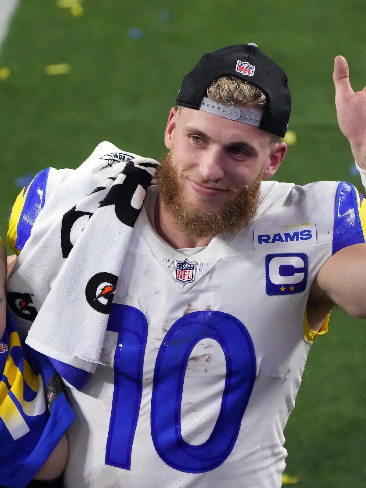 Feb 13, 2022; Inglewood, California, USA; Los Angeles Rams wide receiver Cooper Kupp (10) celebrates holds his son Cypress Stellar after the Rams defeated the Cincinnati Bengals in Super Bowl LVI at SoFi Stadium. Mandatory Credit: Kirby Lee-USA TODAY Sports