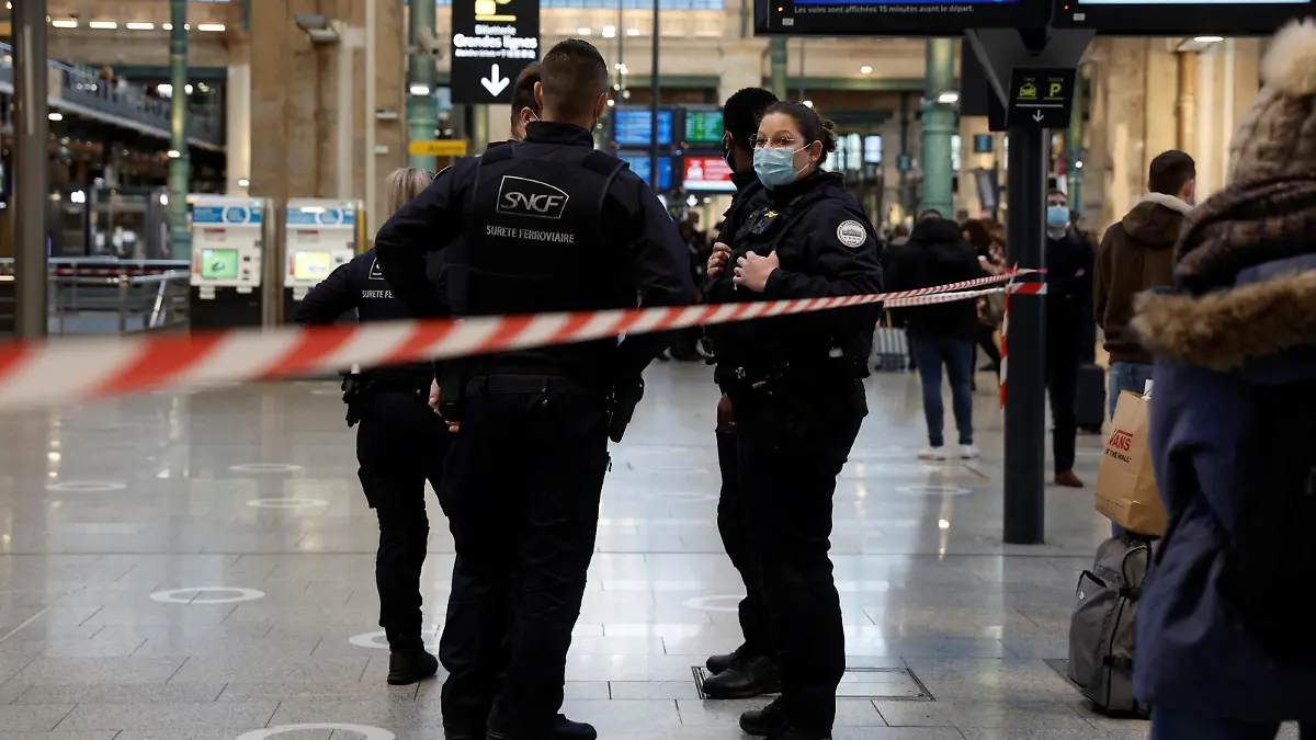 French police secure the scene after French police killed a person who attacked them with a knife at Gare du Nord station in Paris, France, February 14, 2022. REUTERS/Benoit Tessier