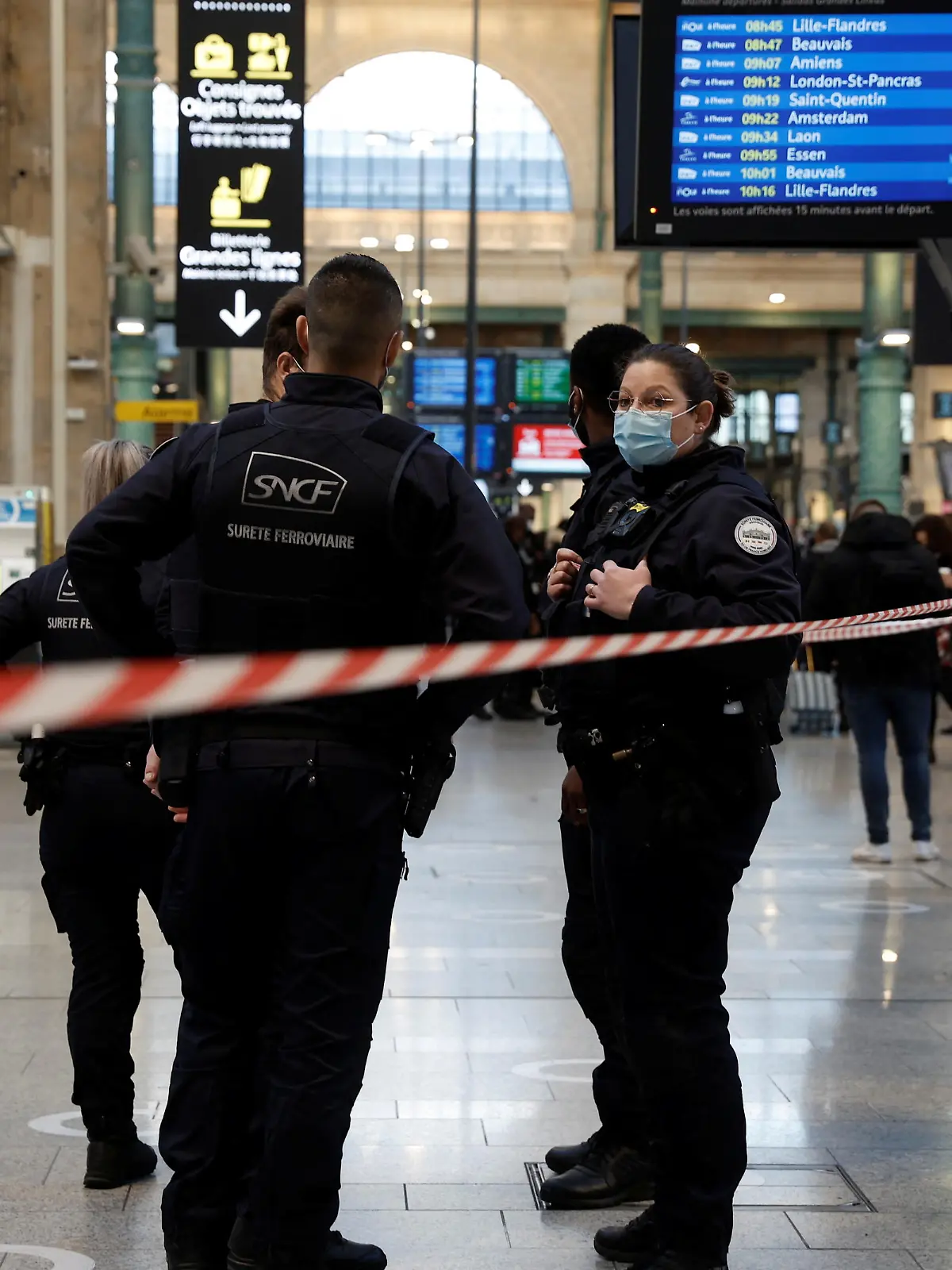 French police secure the scene after French police killed a person who attacked them with a knife at Gare du Nord station in Paris, France, February 14, 2022. REUTERS/Benoit Tessier