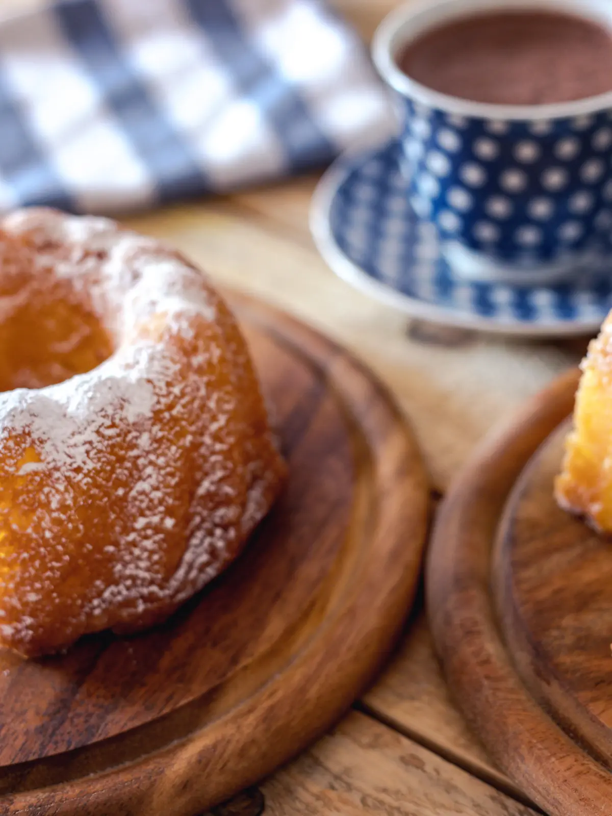 Sweet breakfast, kuglof cake at plate with cups of hot chocolate