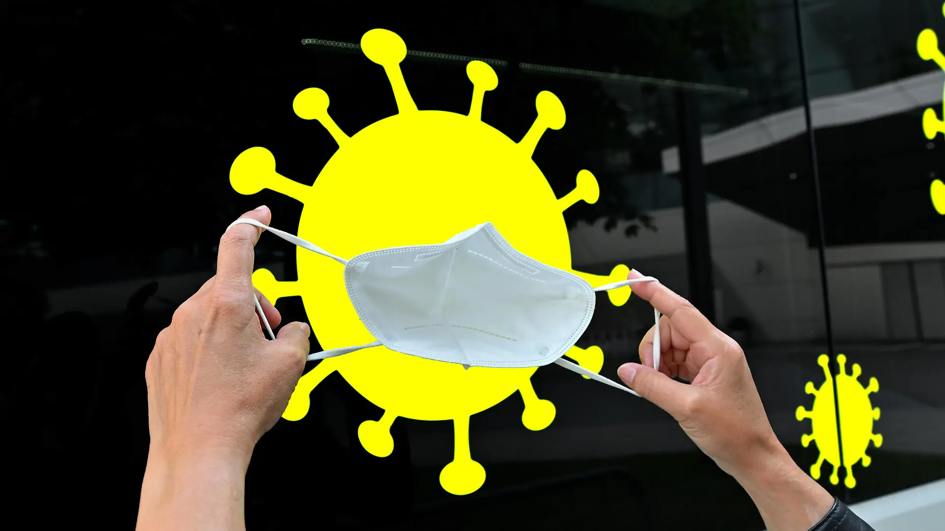 Viren-Abwehr. Hände mit FFP2 Schutzmaske vor einem Coronavirus Piktogramm als Symbolbild. München Bayern Deutschland *** virus defense hands with FFP2 protective mask in front of a coronavirus pictogram as symbol picture Munich Bavaria Germany Copyright: xRolfxPossx