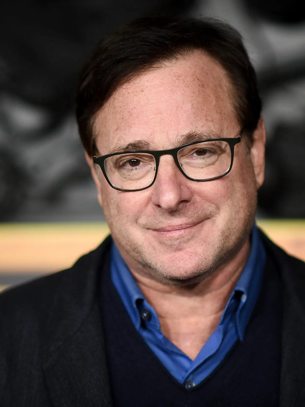FILE - Bob Saget arrives at a screening of "MacGruber" on Dec. 8, 2021, in Los Angeles. Saget's family has released a statement on the cause of his death last month in Florida, citing authorities saying the actor-comedian died from an accidental blow to the head. (Photo by Richard Shotwell/Invision/AP, File)