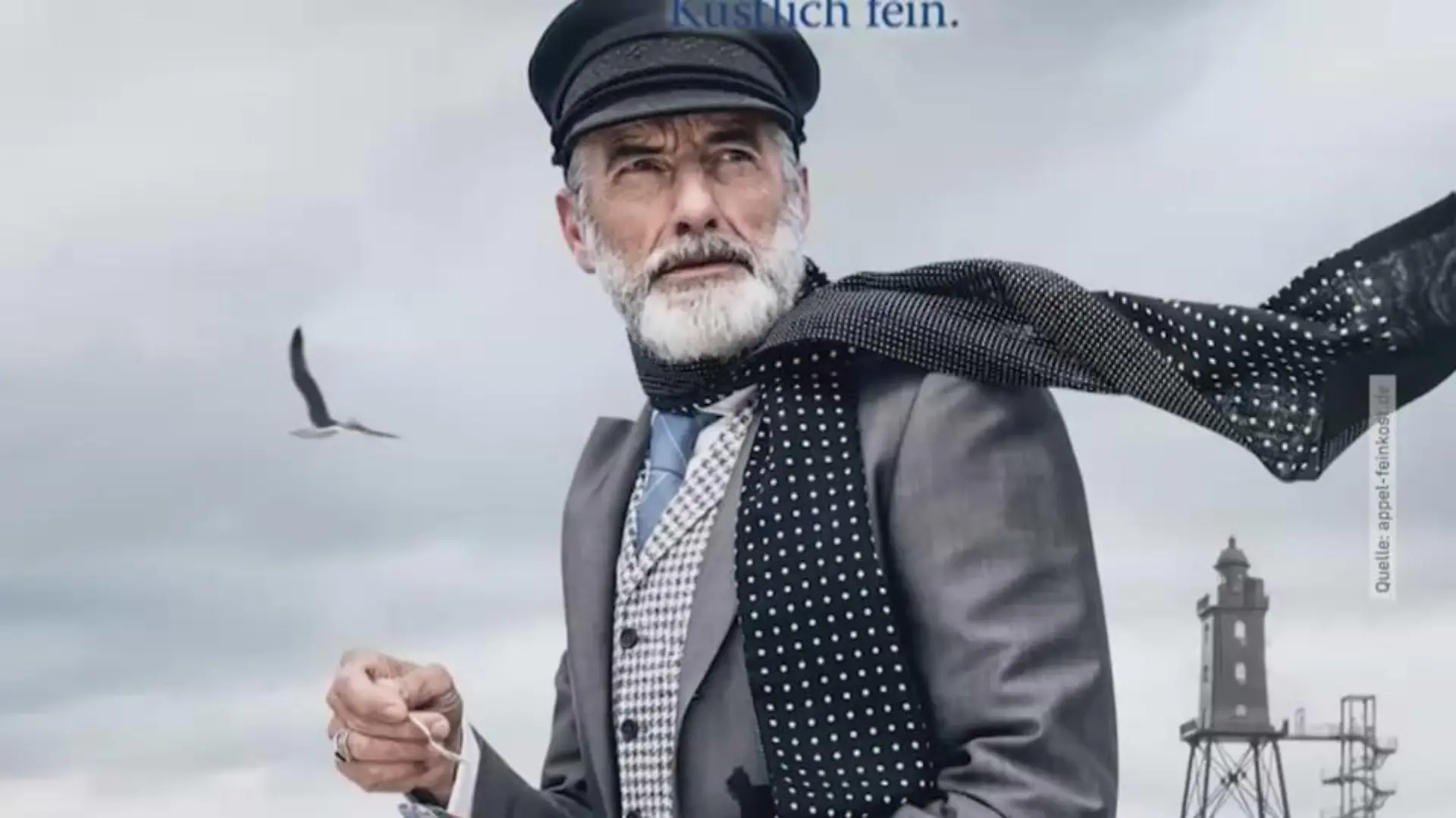 Die Werbefigur von Feinkost Appel: Auch mit Mütze, auch mit Bart - aber im Anzug und mit Halstuch.