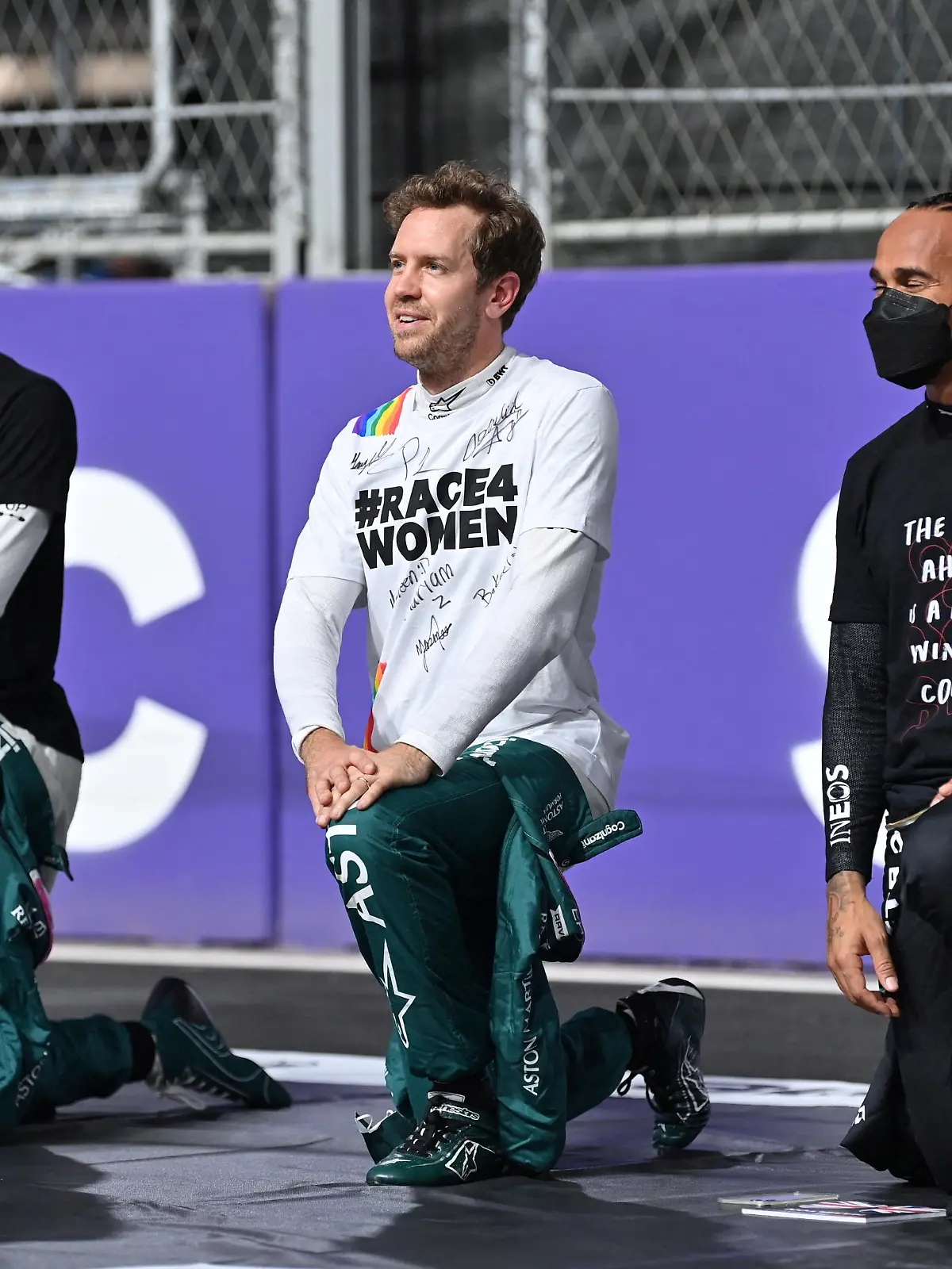 FILE PHOTO: Formula One F1- Saudi Arabian Grand Prix - Jeddah Corniche Circuit, Jeddah, Saudi Arabia - December 5, 2021 Aston Martin's Sebastian Vettel and Mercedes' Lewis Hamilton take the knee before the race Pool via REUTERS/Andrej Isakovic/File Photo