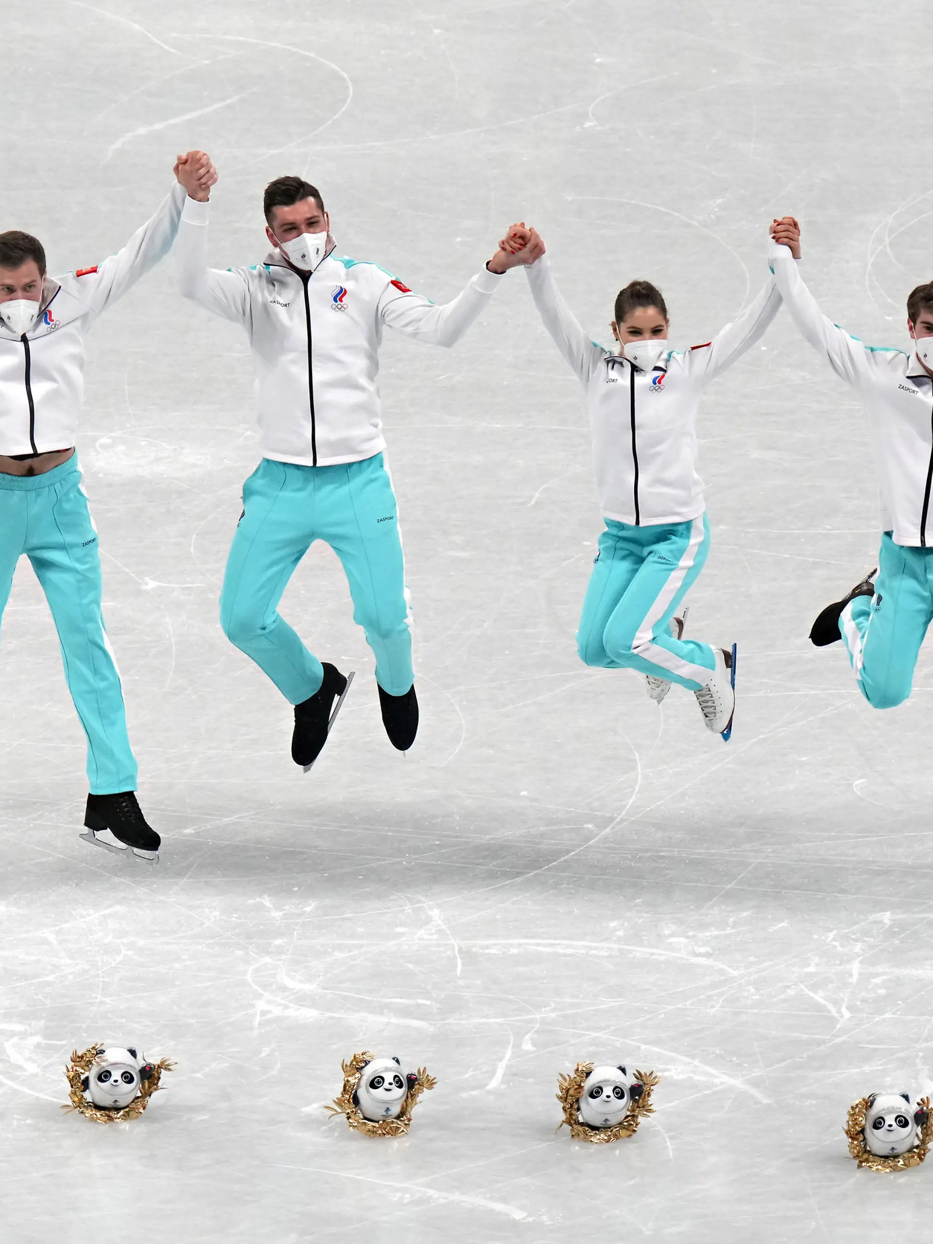 Members of the Russian Skating Team jump for a photos with the mascot dolls Bing Dwen Dwen after winning the gold medal in the Figure Skating Team Event at the Beijing 2022 Winter Olympics on Monday, February 7, 2022. Russia won the gold medal, USA the silver medal and Japan the bronze medal. Photo by Richard Ellis/UPI Photo via Newscom picture alliance