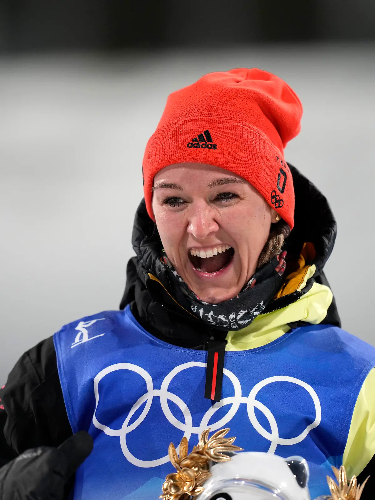 Denise Herrmann of Germany stands on the podium after the women's 15-kilometer individual race at the 2022 Winter Olympics, Monday, Feb. 7, 2022, in Zhangjiakou, China. (AP Photo/Frank Augstein)