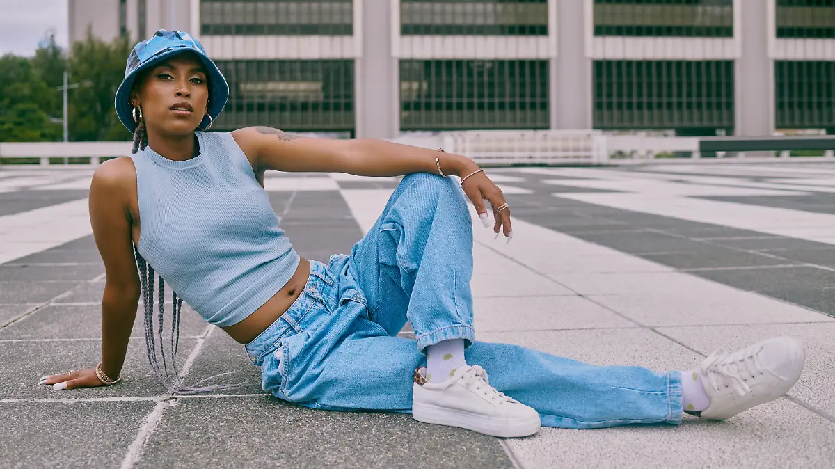Shot of a trendy young woman posing against a city background