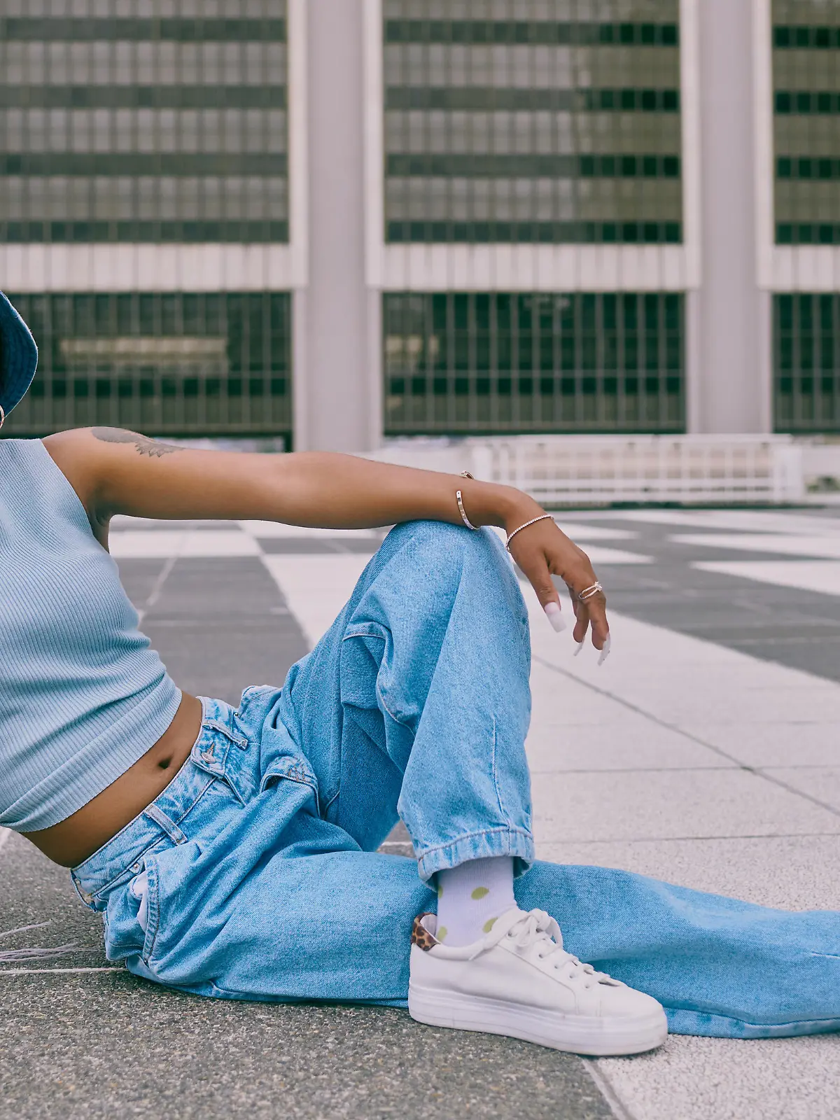 Shot of a trendy young woman posing against a city background