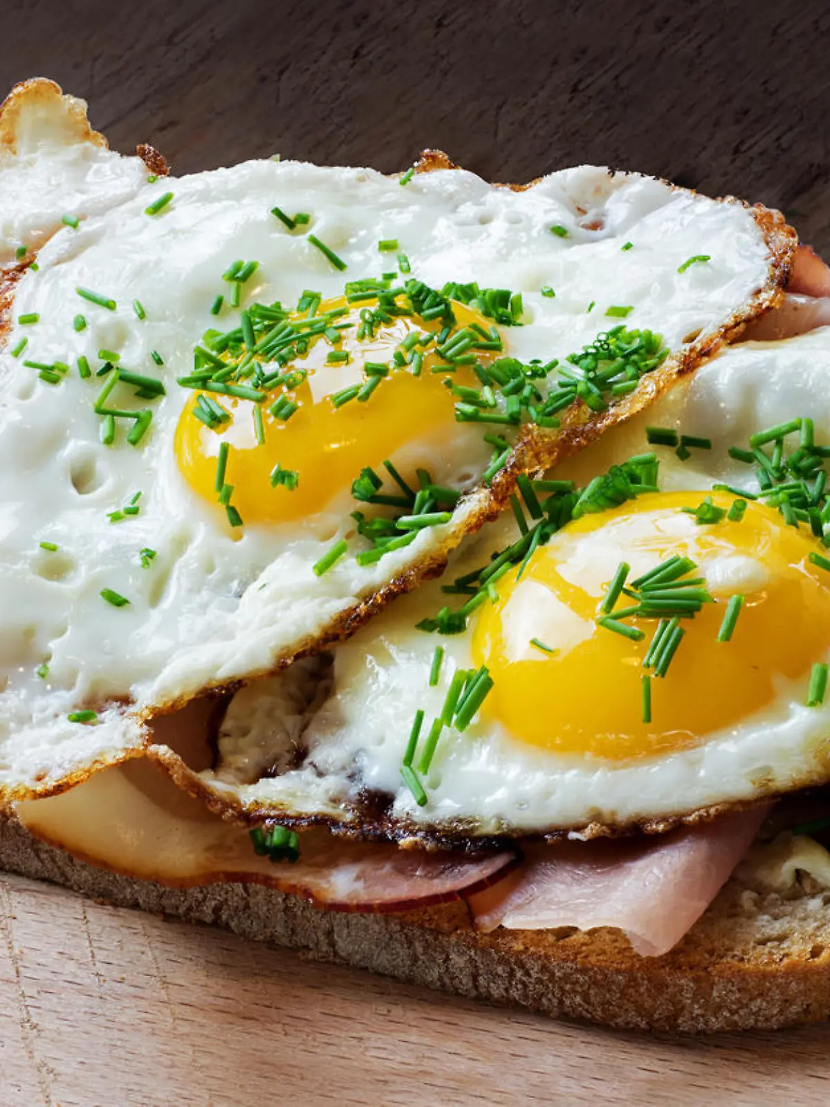 slice of rustic bread with ham or bacon and fried egg, typical  in germany called strammer max