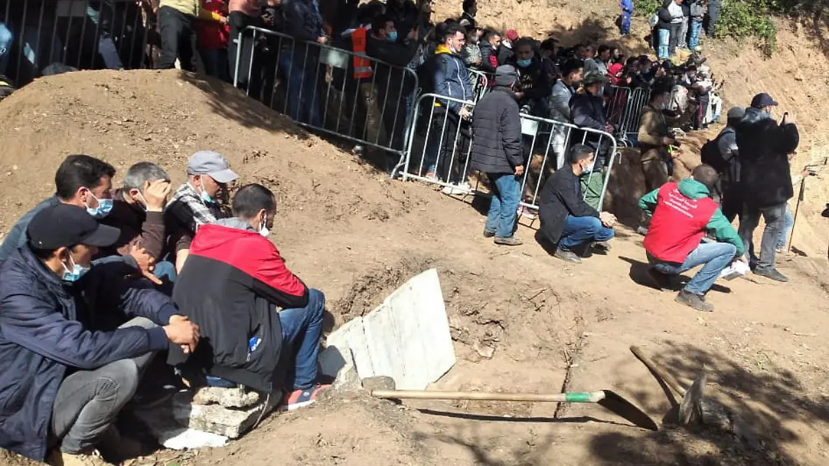 Mourners gather to pay their final respects to 5-year-old child, Rayan Awram, who died on Saturday after a days-long effort to rescue him from a well, during his funeral near Chefchaouen, Morocco February 7, 2022. REUTERS/Chakir Lakhlifi NO RESALES. NO ARCHIVES