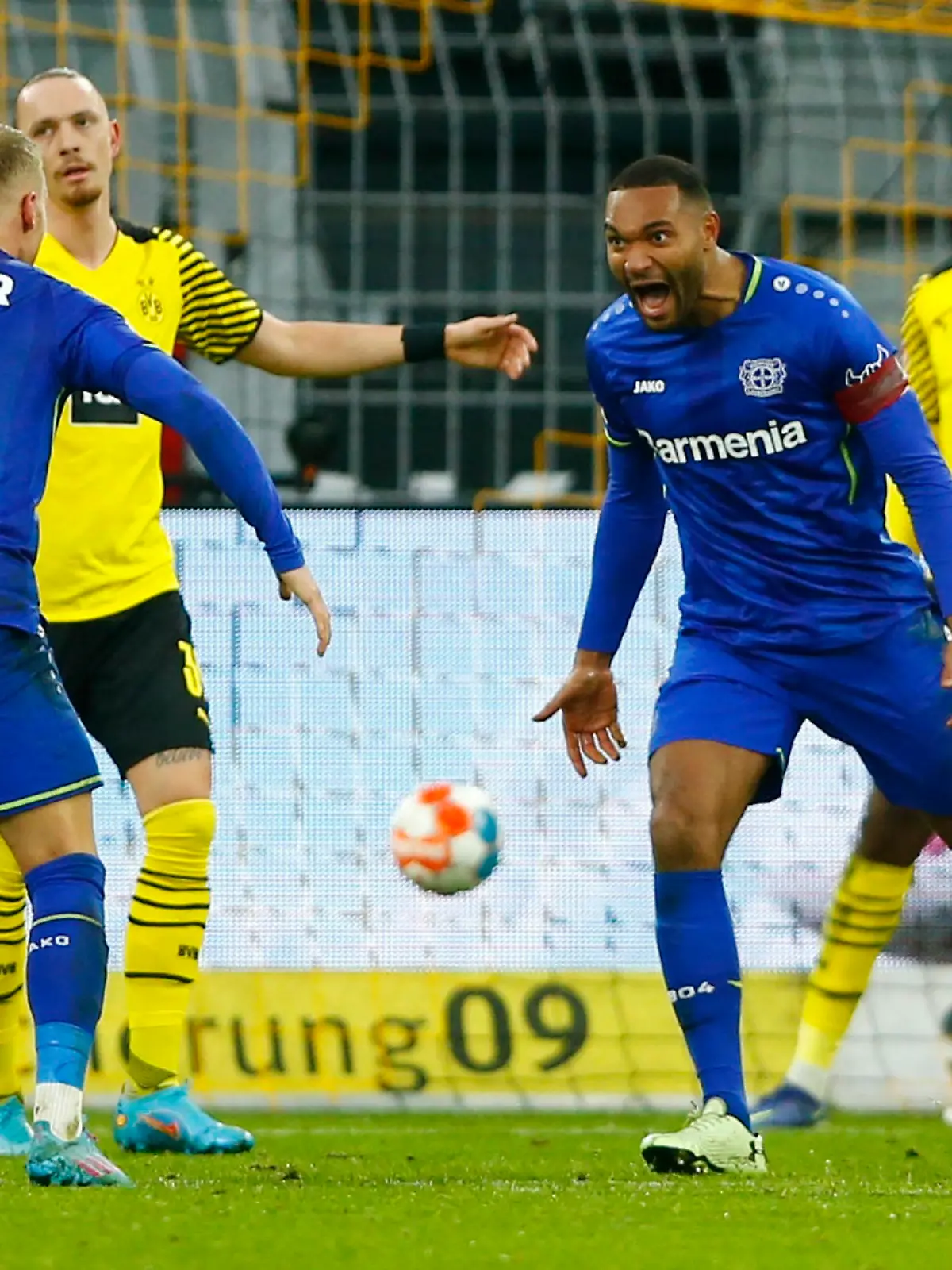 Soccer Football - Bundesliga - Borussia Dortmund v Bayer Leverkusen - Signal Iduna Park, Dortmund, Germany - February 6, 2022 Bayer Leverkusen's Jonathan Tah celebrates scoring their fourth goal with Mitchel Bakker REUTERS/Thilo Schmuelgen DFL REGULATIONS PROHIBIT ANY USE OF PHOTOGRAPHS AS IMAGE SEQUENCES AND/OR QUASI-VIDEO.