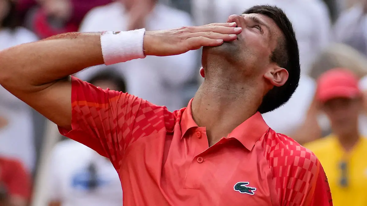 Serbia's Novak Djokovic celebrates winning the men's singles final match of the French Open tennis tournament against Norway's Casper Ruud in three sets, 7-6, (7-1), 6-3, 7-5, at the Roland Garros stadium in Paris, Sunday, June 11, 2023. Djokovic won his record 23rd Grand Slam singles title, breaking a tie with Rafael Nadal for the most by a man. (AP Photo/Christophe Ena)