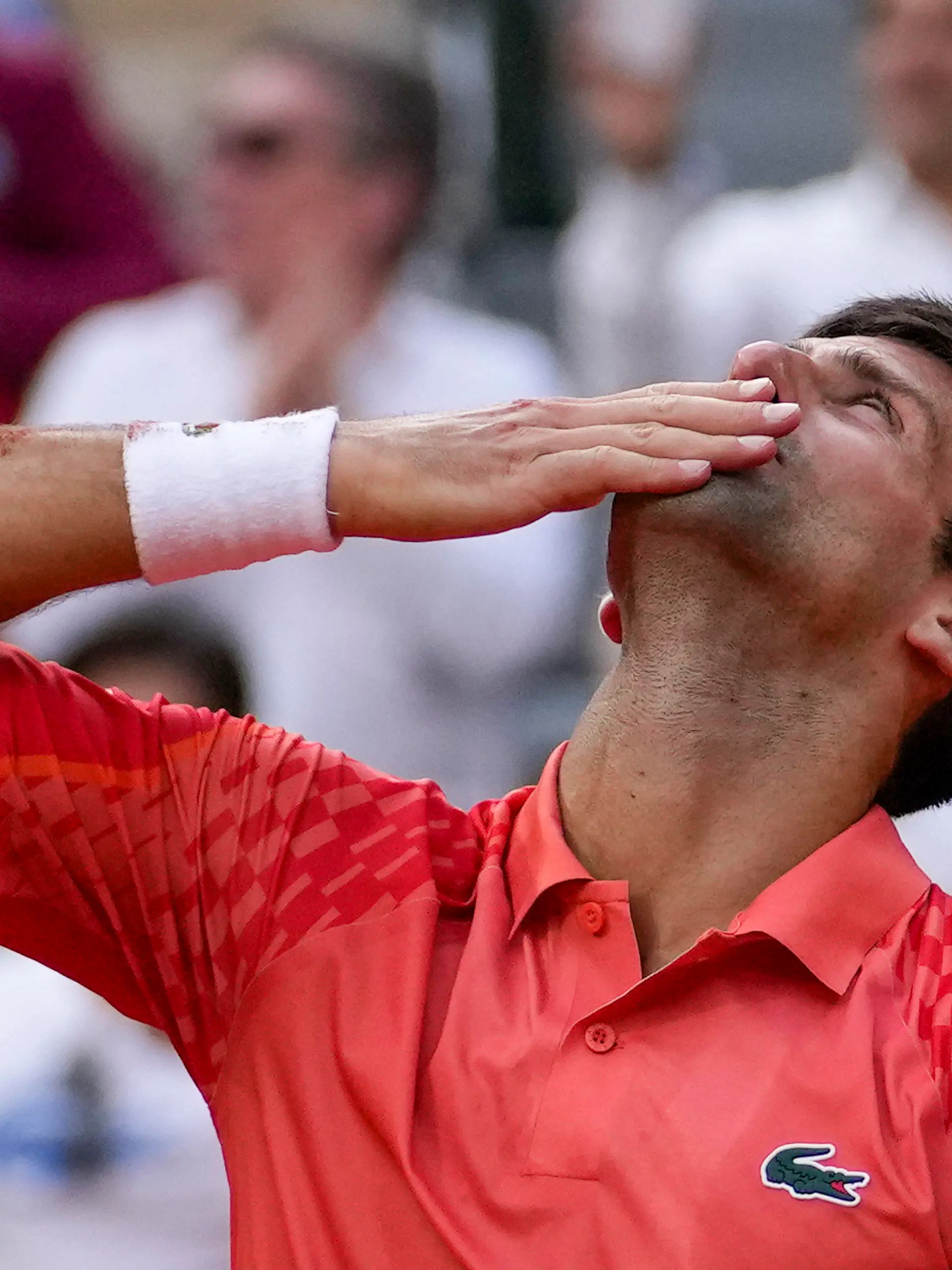 Serbia's Novak Djokovic celebrates winning the men's singles final match of the French Open tennis tournament against Norway's Casper Ruud in three sets, 7-6, (7-1), 6-3, 7-5, at the Roland Garros stadium in Paris, Sunday, June 11, 2023. Djokovic won his record 23rd Grand Slam singles title, breaking a tie with Rafael Nadal for the most by a man. (AP Photo/Christophe Ena)