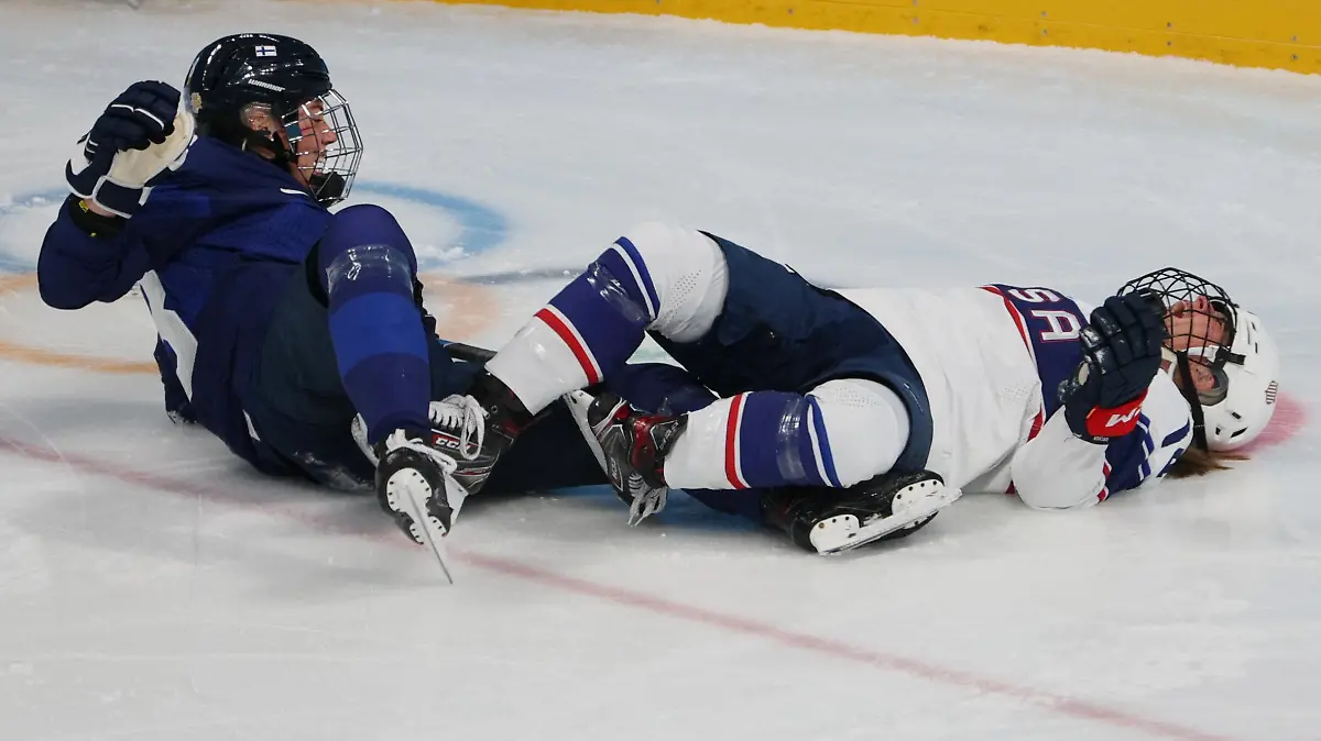 2022 Beijing Olympics - Ice Hockey - Women's Prelim. Round - Group A - Finland v United States - Wukesong Sports Centre, Beijing, China - February 3, 2022. Ronja Savolainen of Finland and Brianna Decker of United States clash. REUTERS/Brian Snyder