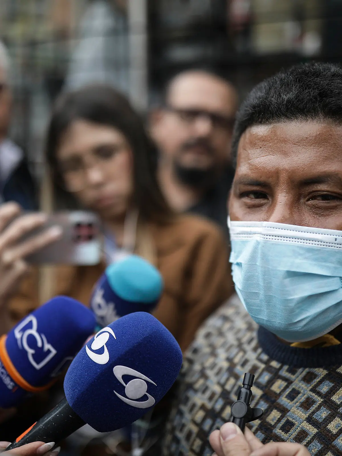 Manuel Ranoque, the father of two of the youngest Indigenous children who survived an Amazon plane crash that killed three adults, and then braved the jungle for 40 days before being found alive, speaks to the media from the entrance of the military hospital where the children are receiving medical attention, in Bogota, Colombia, Sunday, June 11, 2023. (AP Photo/Ivan Valencia)