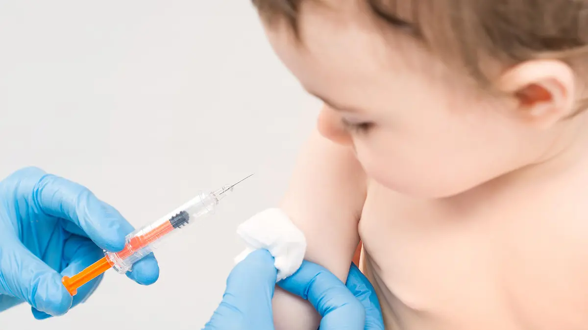 vaccine vaccination child baby doctor injection pediatrician injecting arm health immunization hand hospital needle syringe concept - stock image