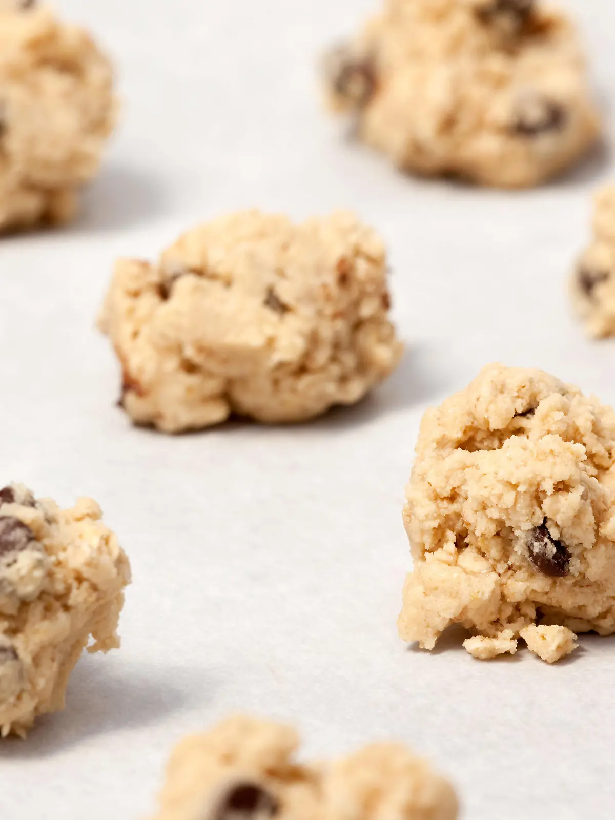 Raw Cookie Dough Raw cookie dough on a baking sheet with parchment PUBLICATIONxINxGERxSUIxAUTxONLY Copyright: xleafx 1302439