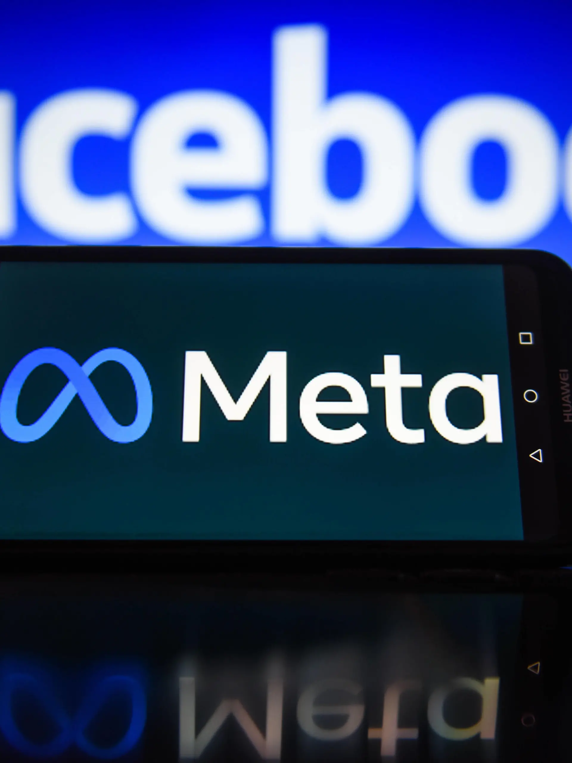  January 3, 2022, Krakow, Poland: In this photo illustration a Meta logo seen displayed on a smartphone with Facebook logo in the background. Krakow Poland - ZUMAs197 20220103_zab_s197_027 Copyright: xOmarxMarquesx
