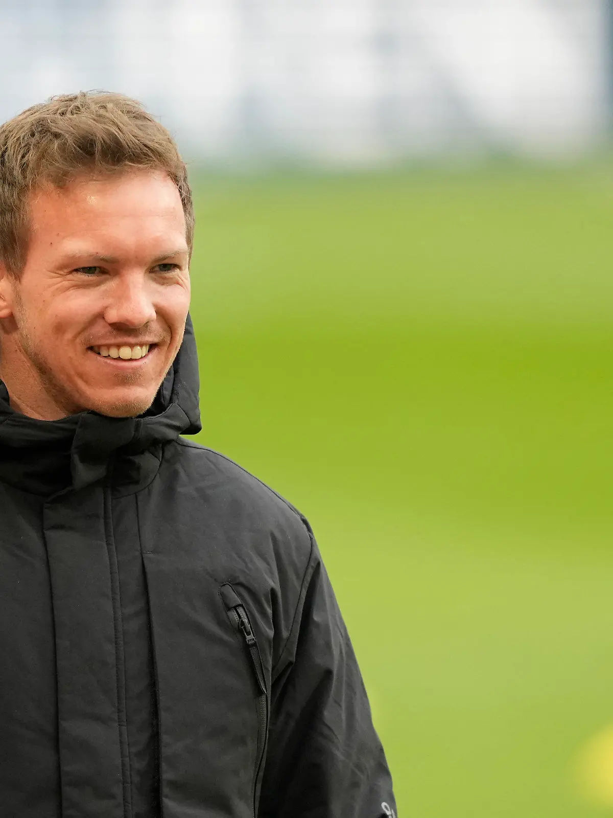 Bayern's head coach Julian Nagelsmann watches his players warm up ahead of the German Bundesliga soccer match between FC Cologne and Bayern Munich in Cologne, Germany, Saturday, Jan. 15, 2022. (AP Photo/Martin Meissner)