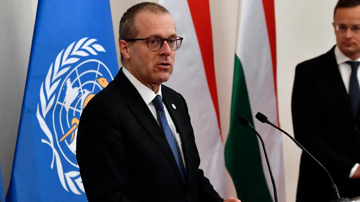 FILE - Hans Kluge, Regional Director for Europe at the World Health Organization (WHO) hold a press conference with Hungarian Minister of Foreign Affairs and Trade Peter Szijjarto, right, at the Ministry of Foreign Affairs and Trade in Budapest, April 21, 2021. The director of the World Health Organization’s Europe office said the continent is now facing a “plausible endgame” to the pandemic and that the number of coronavirus deaths is now starting to plateau. During a press briefing on Thursday, Feb. 3, 2022 WHO’s Dr. Hans Kluge said there is a “singular opportunity” for countries to take control of COVID-19’s transmission. (Zoltan Mathe/MTI via AP)