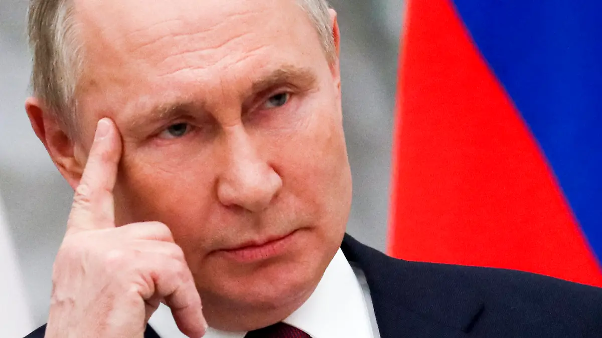 Russian President Vladimir Putin listens to a journalist's question during a joint news conference with Hungary's Prime Minister Viktor Orban following their talks in the Kremlin in Moscow, Russia, Tuesday, Feb. 1, 2022. Putin says the U.S. and its allies have ignored Russia's top security demands. In his first comments on the standoff with the West over Ukraine in more than a month, Putin said Tuesday that the Kremlin is still studying the U.S. and NATO's response to the Russian security demands received last week. (Yuri Kochetkov/Pool Photo via AP)
