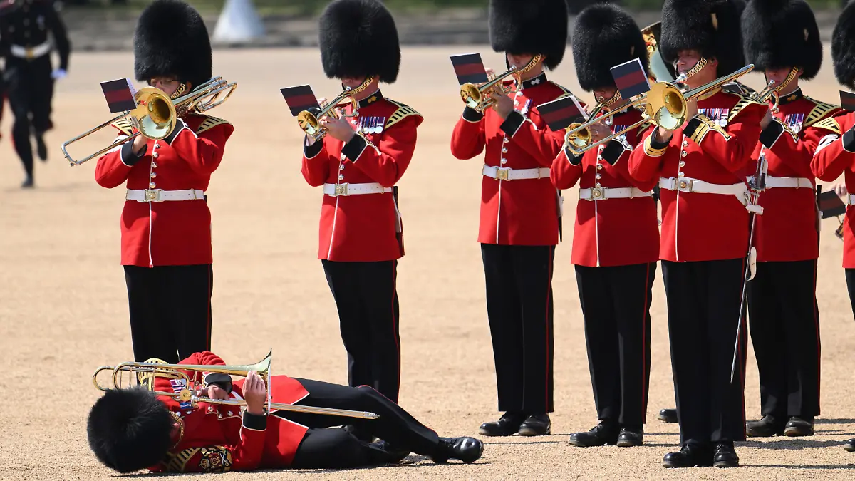 LONDON, ENGLAND - JUNE 10: A member of The Band of the Welsh Guards faints as Prince William, Prince of Wales Carries Out The Colonel's Review at Horse Guards Parade on June 10, 2023 in London, England. The Prince of Wales carried out the review of the Welsh Guards for the first time as Colonel of the Regiment. It is the final evaluation of the King's Birthday parade ahead of the event on June 17. (Photo by Karwai Tang/WireImage)
