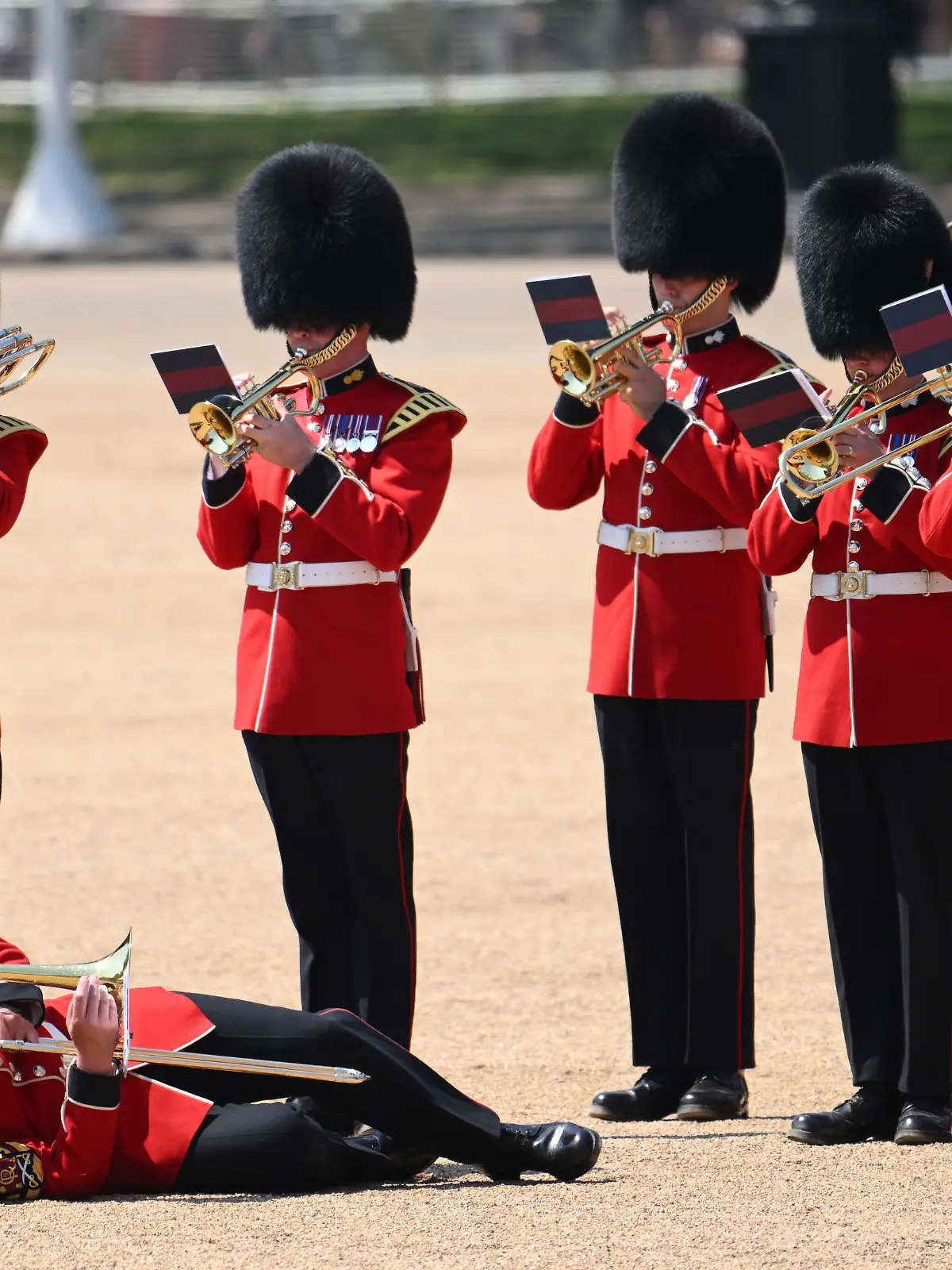 LONDON, ENGLAND - JUNE 10: A member of The Band of the Welsh Guards faints as Prince William, Prince of Wales Carries Out The Colonel's Review at Horse Guards Parade on June 10, 2023 in London, England. The Prince of Wales carried out the review of the Welsh Guards for the first time as Colonel of the Regiment. It is the final evaluation of the King's Birthday parade ahead of the event on June 17.  (Photo by Karwai Tang/WireImage)