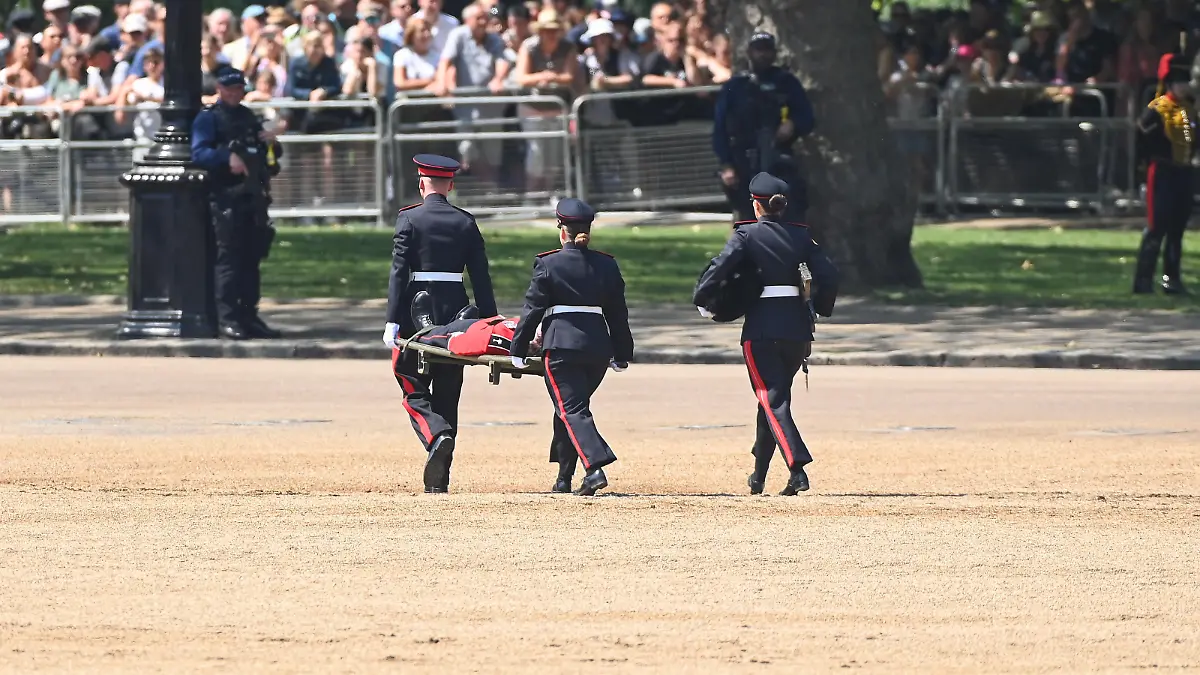 LONDON, ENGLAND - JUNE 10: A Welsh Guardsman is stretchered away while Prince William, Prince of Wales Carries Out The Colonel's Review at Horse Guards Parade on June 10, 2023 in London, England. The Prince of Wales carried out the review of the Welsh Guards for the first time as Colonel of the Regiment. It is the final evaluation of the King's Birthday parade ahead of the event on June 17. (Photo by Stuart C. Wilson/Getty Images)