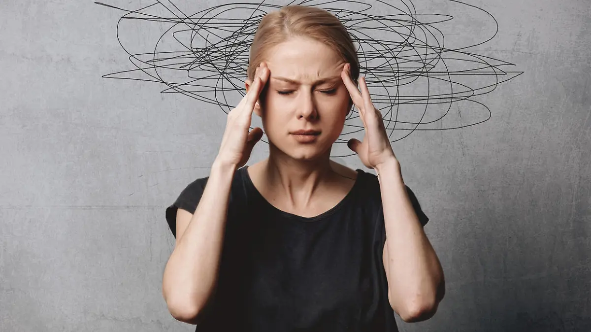 Woman with headache on grey background