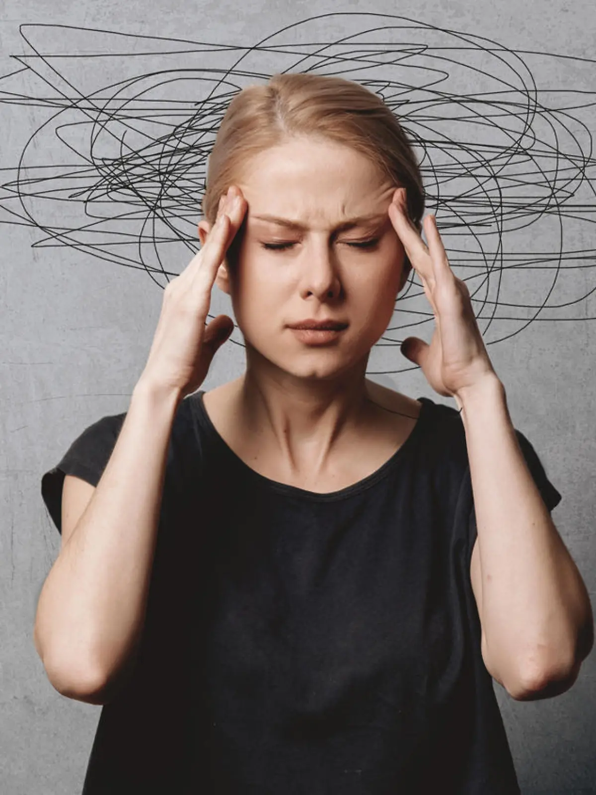Woman with headache on grey background