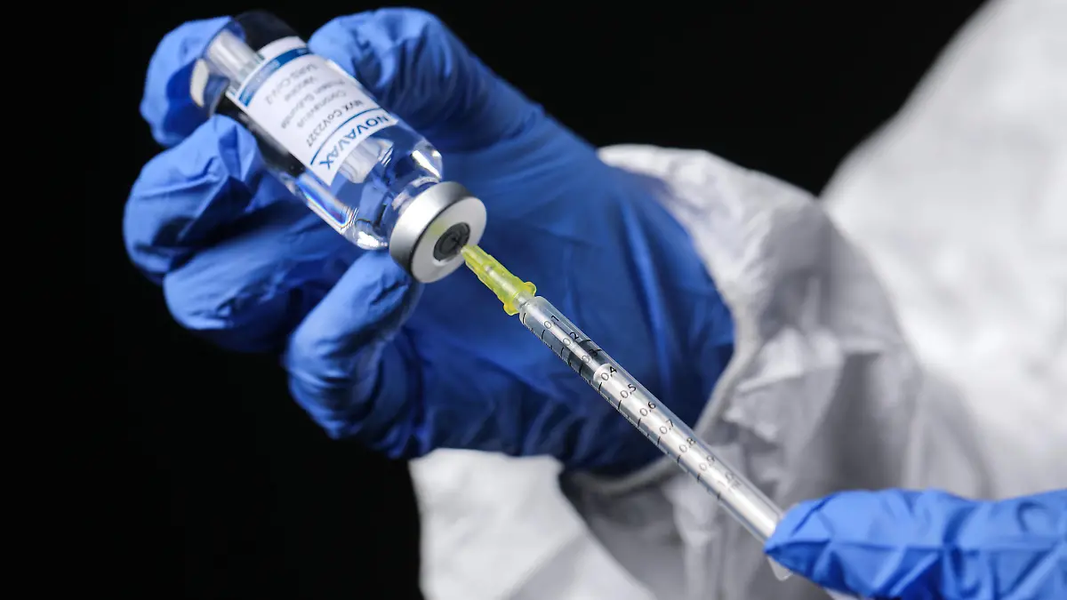 Novavax, a new coronavirus vaccine, is on the market, and Indonesia was the first to approve it Illustration of a healthcare worker in a protective ward with a surgical mask holding a vial of vaccineI. Novavax is a new coronavirus vaccine on the market, and Indonesia was the first to approve it. in Zagreb, Croatia, on November 04, 2021. TomislavxMiletic/PIXSELL