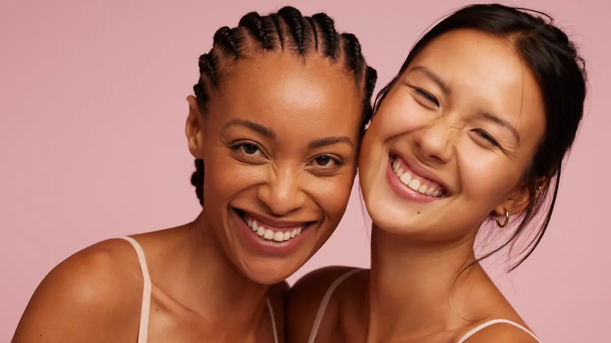 Portrait of a cheerful young women looking at camera and smiling.  Natural Beauties with fresh and clean skin