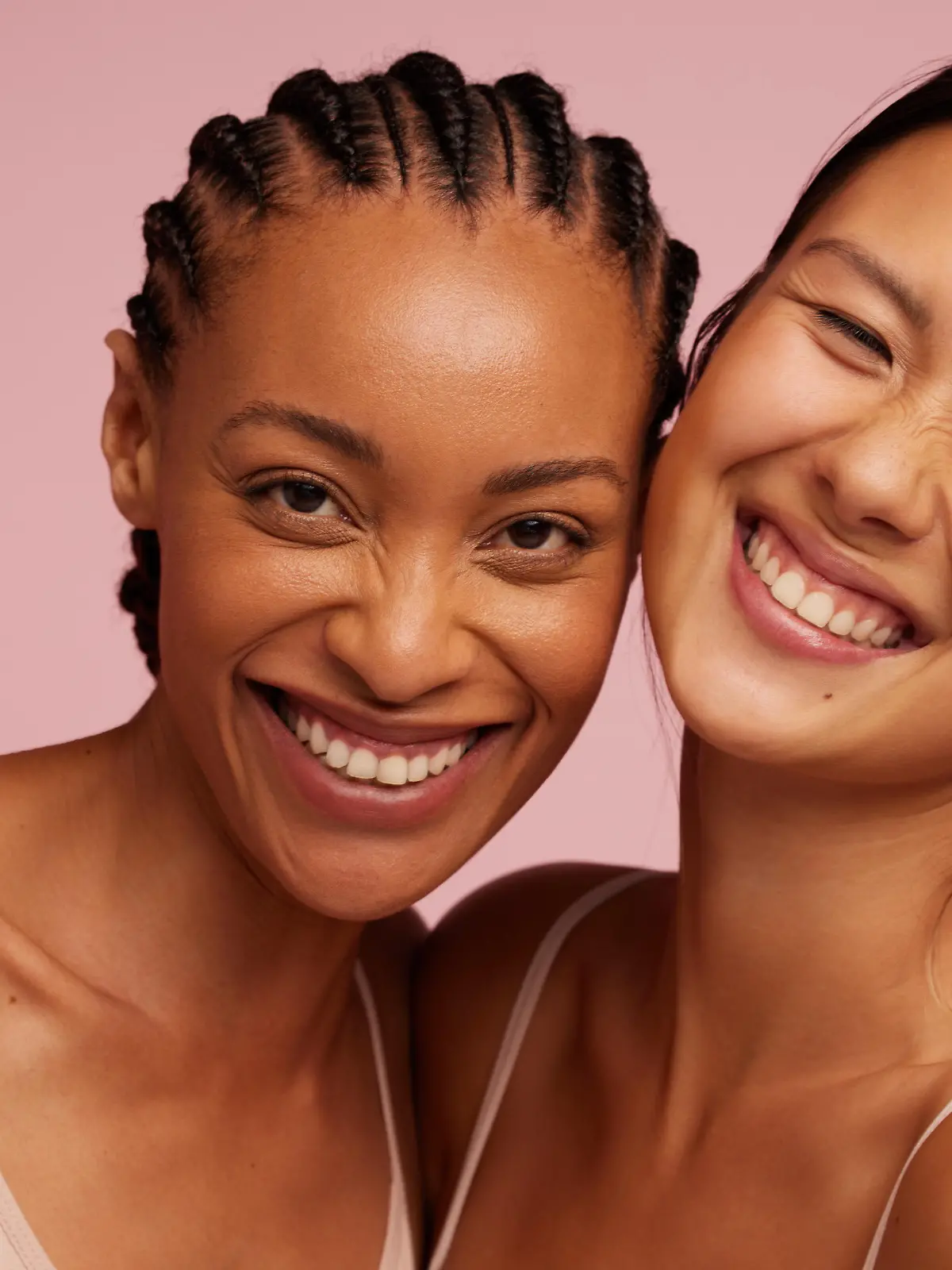 Portrait of a cheerful young women looking at camera and smiling.  Natural Beauties with fresh and clean skin